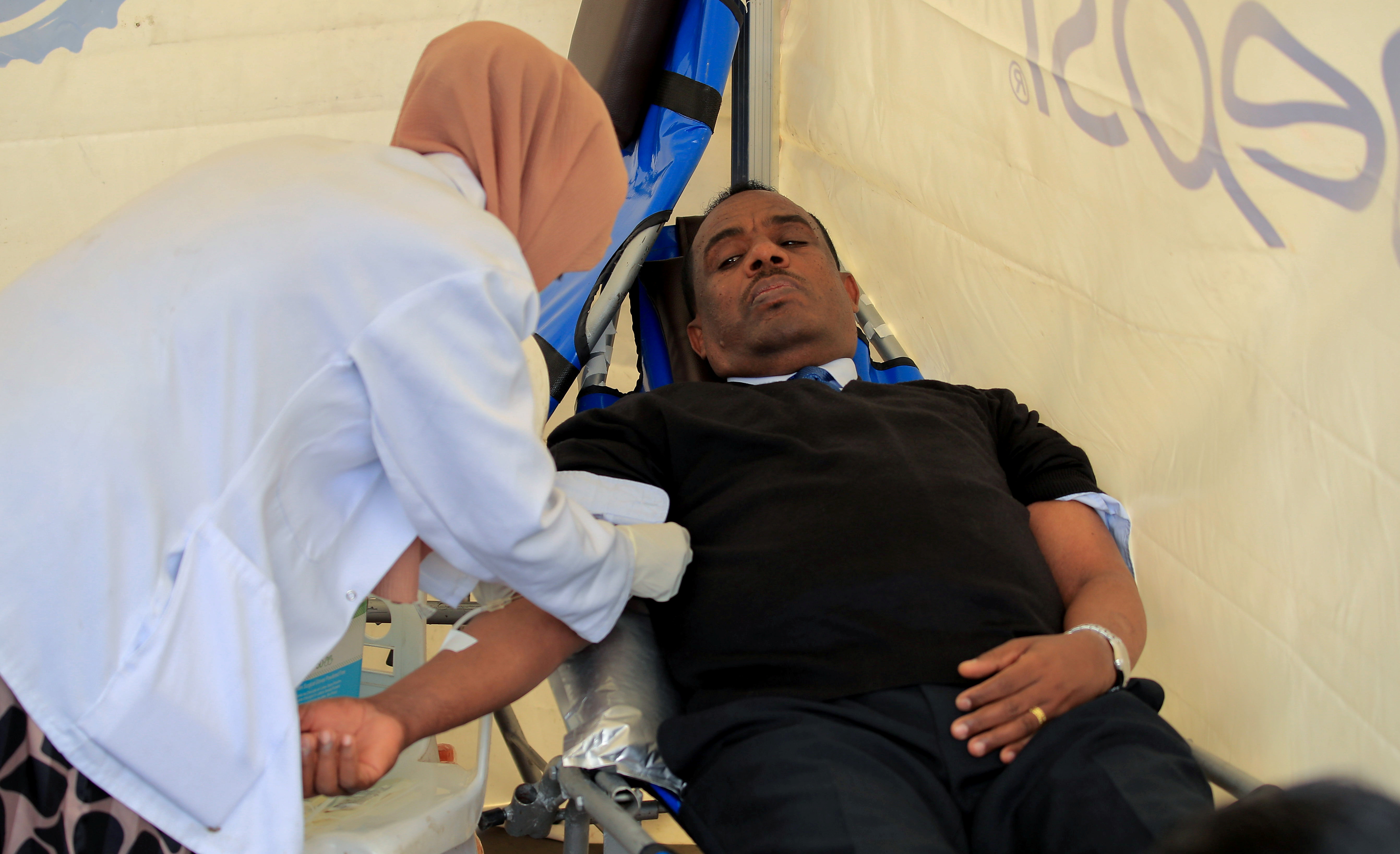 Kenea Yadeta, Defense Minister of Ethiopia, donates blood during the farewell ceremony for the Recruits to join Ethiopia's Defense Force at the Meskel Square in Addis Ababa, Ethiopia July 27, 2021. REUTERS/Tiksa Negeri