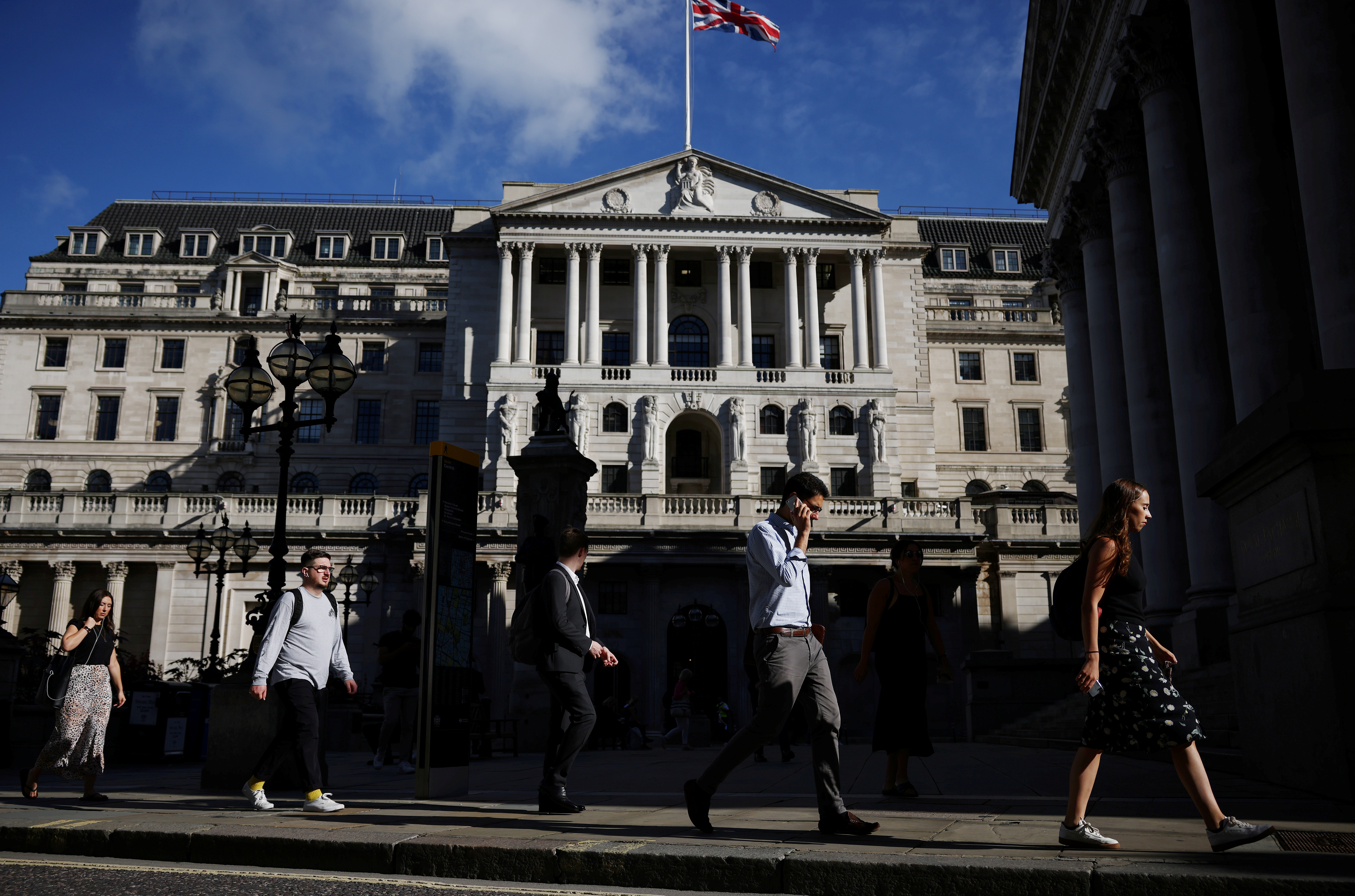 People walk past the Bank of England during morning rush hour, amid the coronavirus disease (COVID-19) pandemic in London, Britain, July 29, 2021. REUTERS/Henry Nicholls