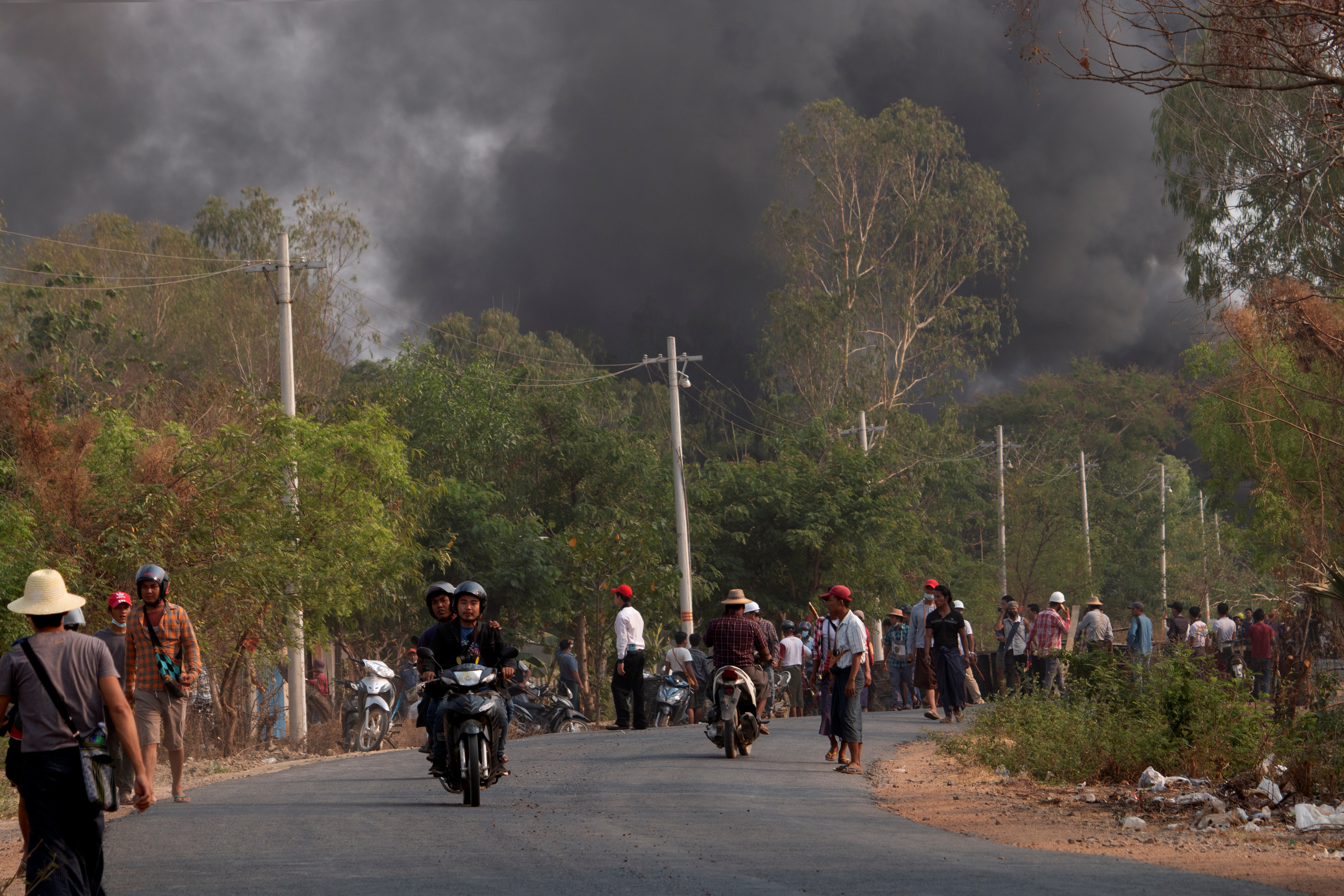 Demonstrators are seen before a clash with security forces in Taze, Myanmar