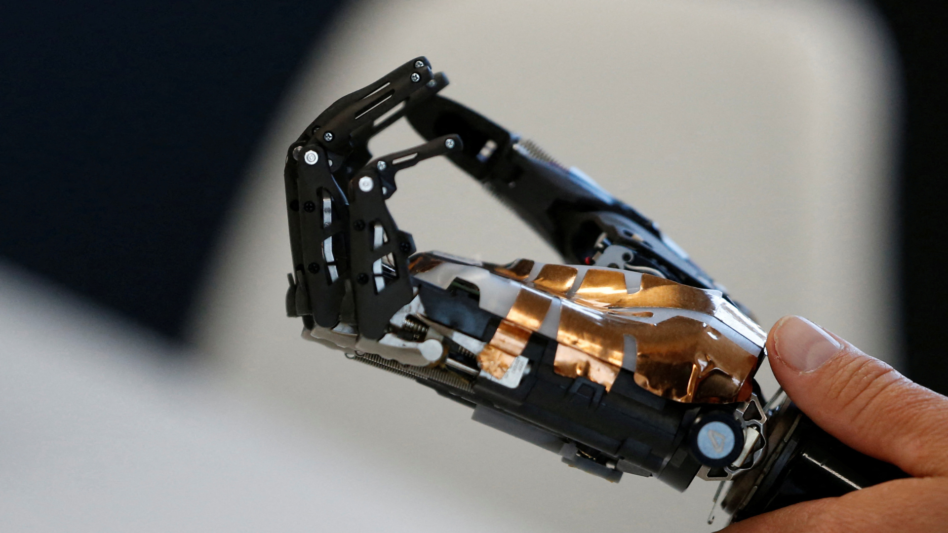 A person holds a bionic hand developed by COVVI, at Quayside Business Park in Leeds, Britain August 11, 2022. REUTERS/Craig Brough