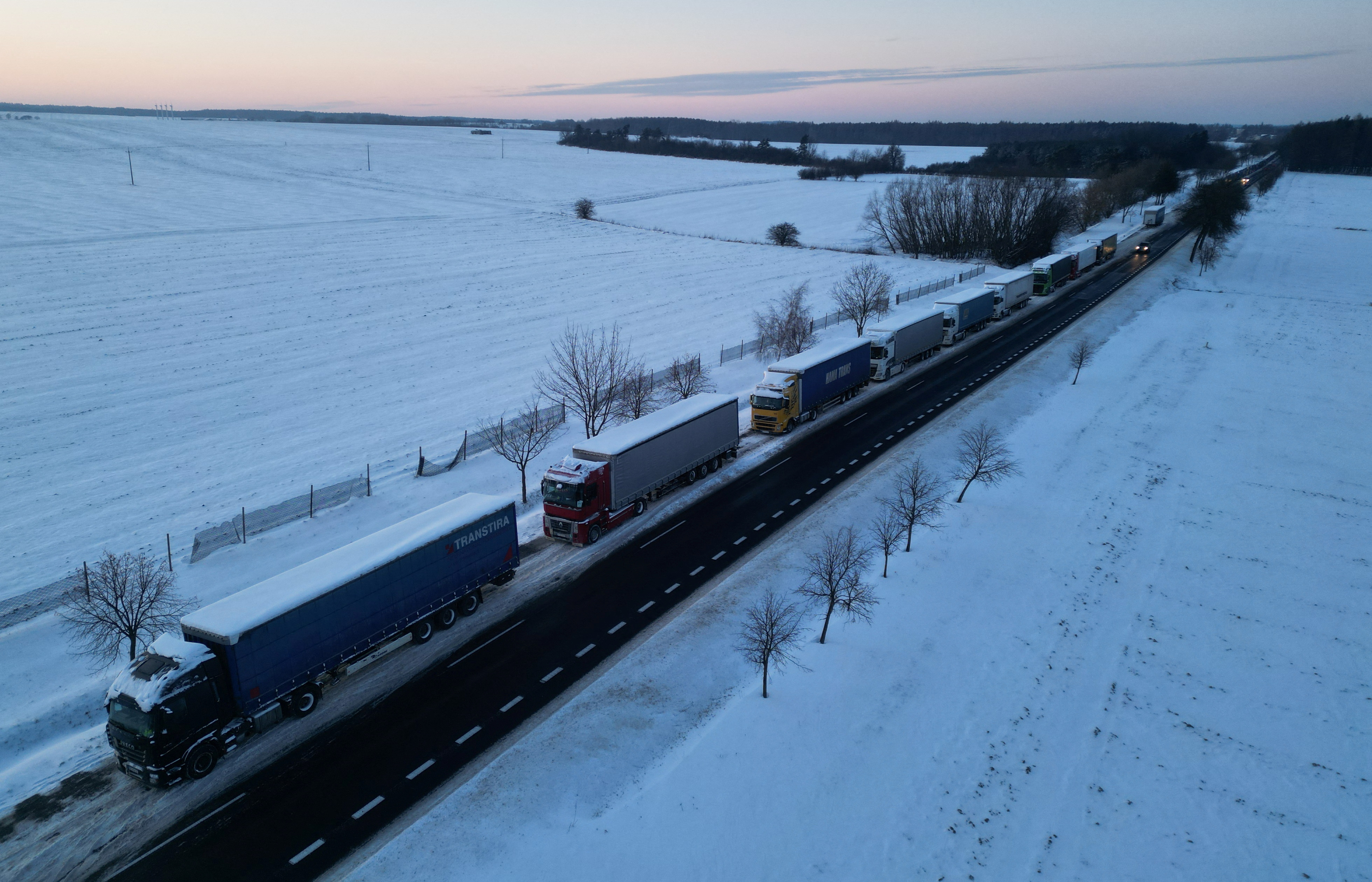 Trucks line up in a long queue to cross the Polish-Ukrainian border at the Hrebenne-Rawa Ruska crossing in Potoki