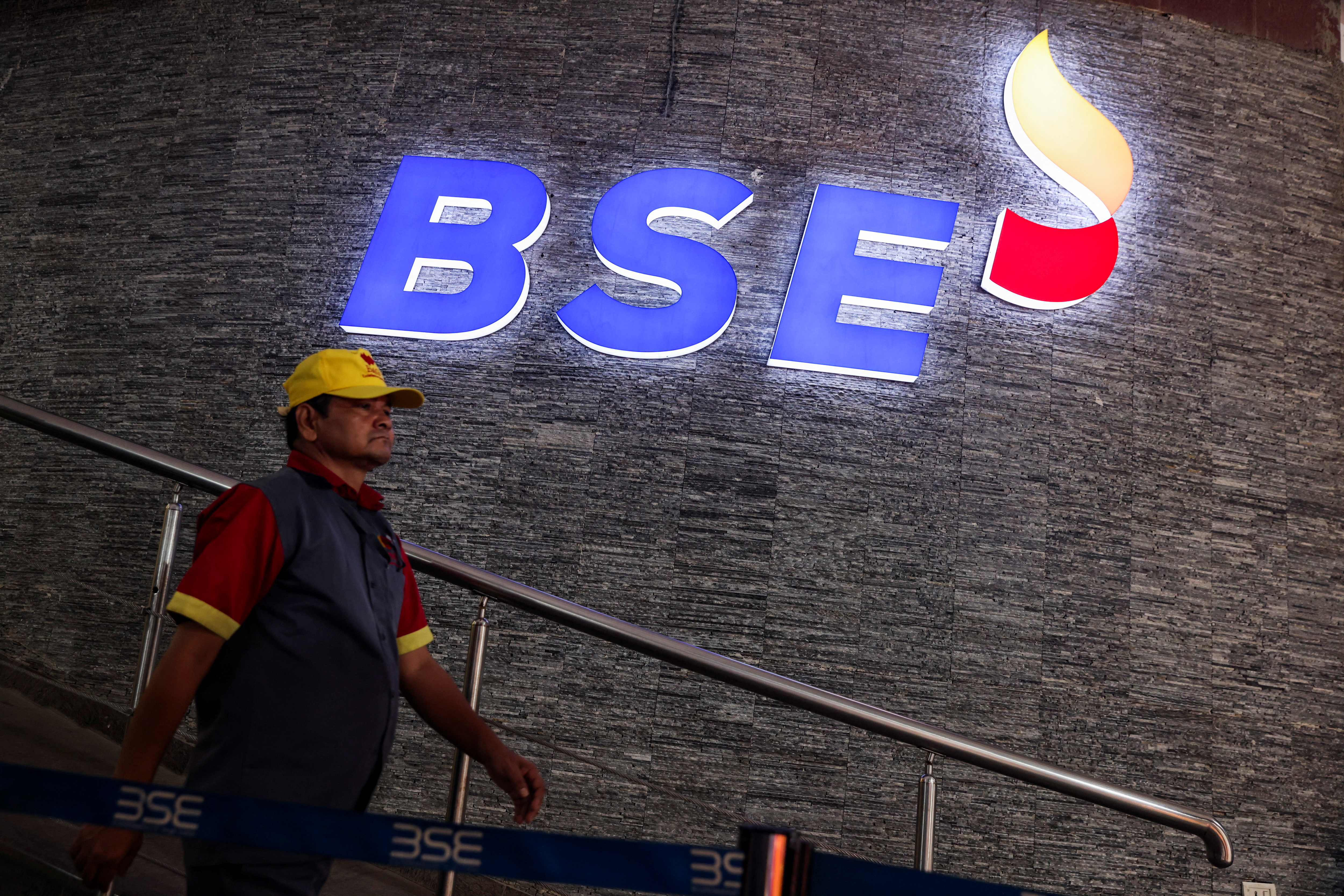 A man walks past the new logo of the Bombay Stock Exchange (BSE) building in Mumbai