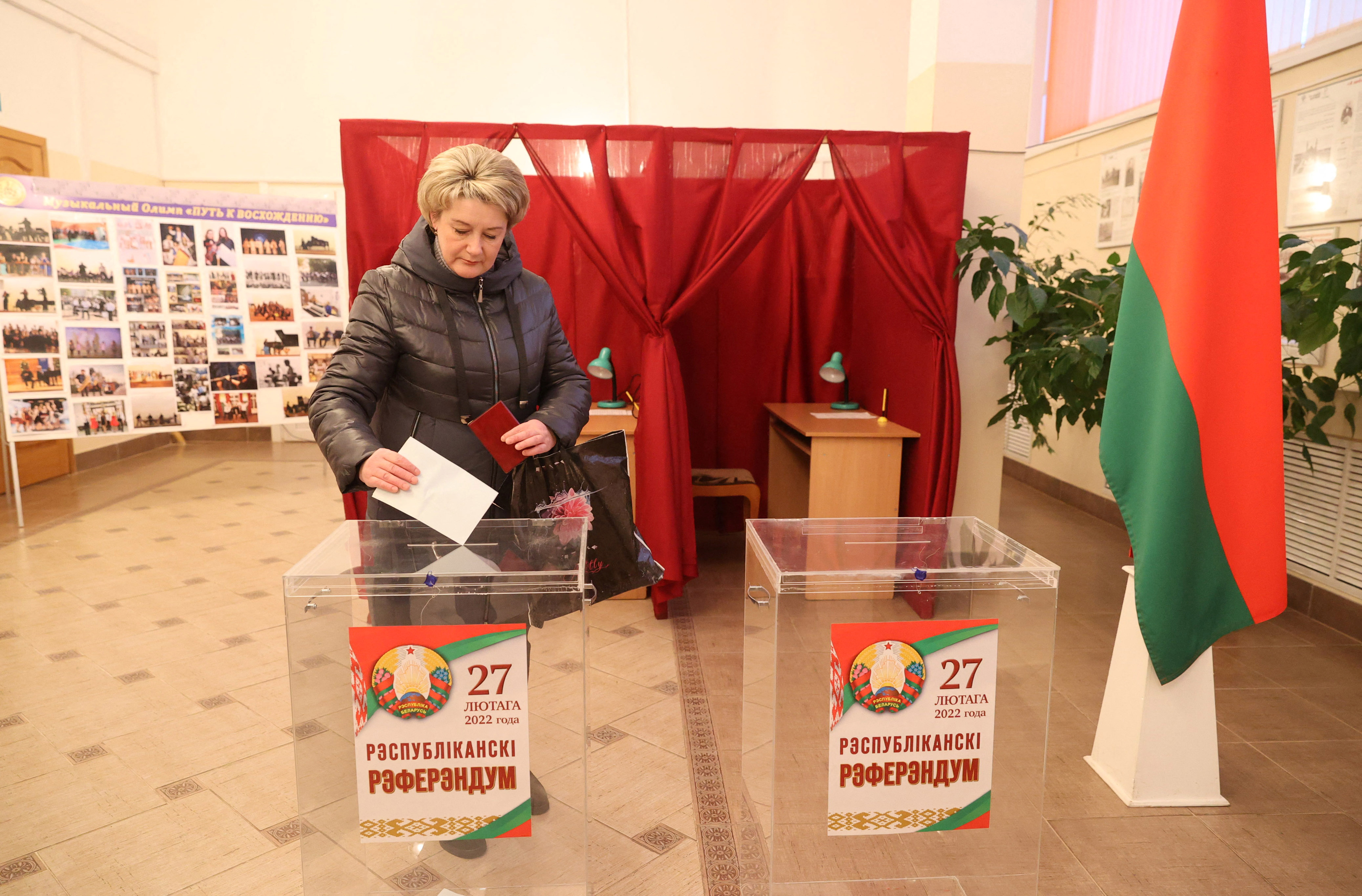 A woman casts her ballot at the constitutional referendum in Vitebsk