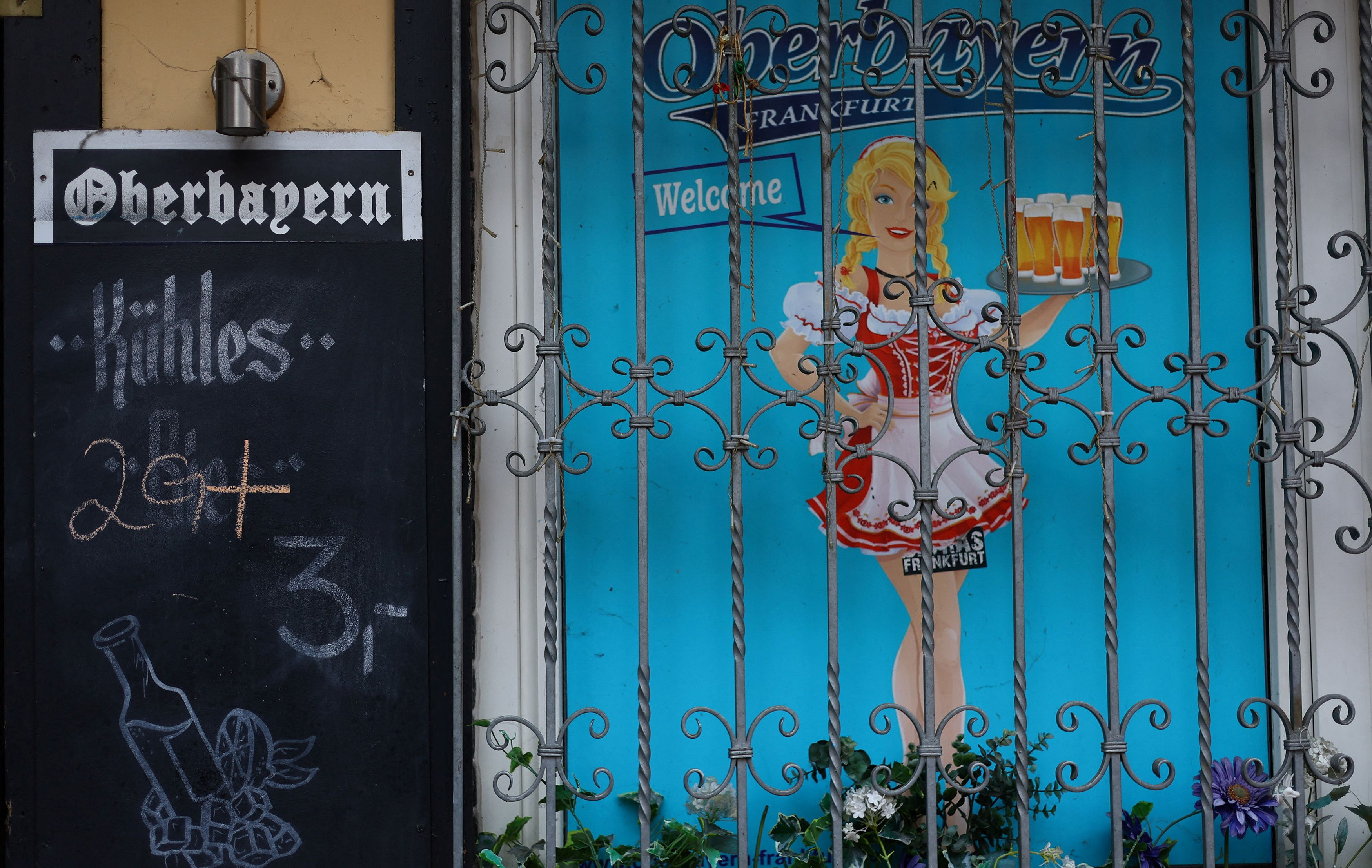 Signs show requirements to enter restaurants and bars as the spread of the coronavirus disease (Covid-19) continues in Frankfurt