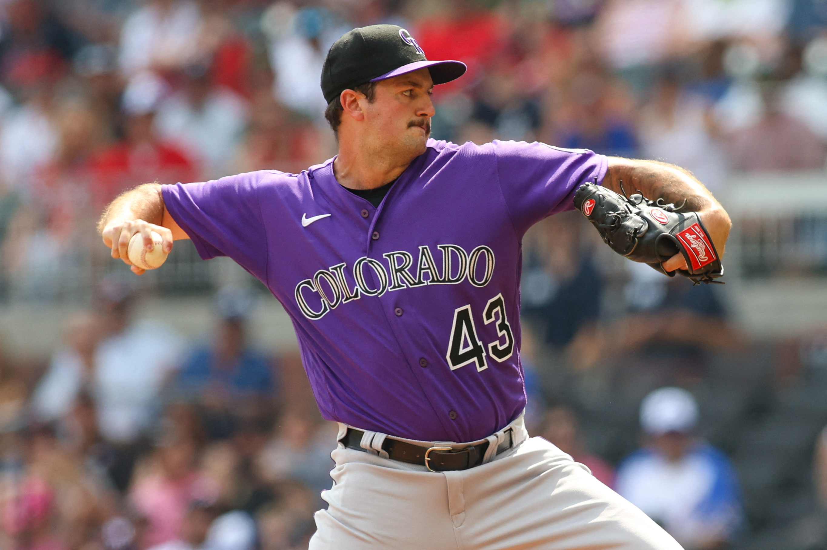 Denver CO, USA. 3rd June, 2022. Atlanta first baseman Matt Olsen (28)  drives in runs int he 10 th inning during the game with Atlanta Braves and  Colorado Rockies held at Coors