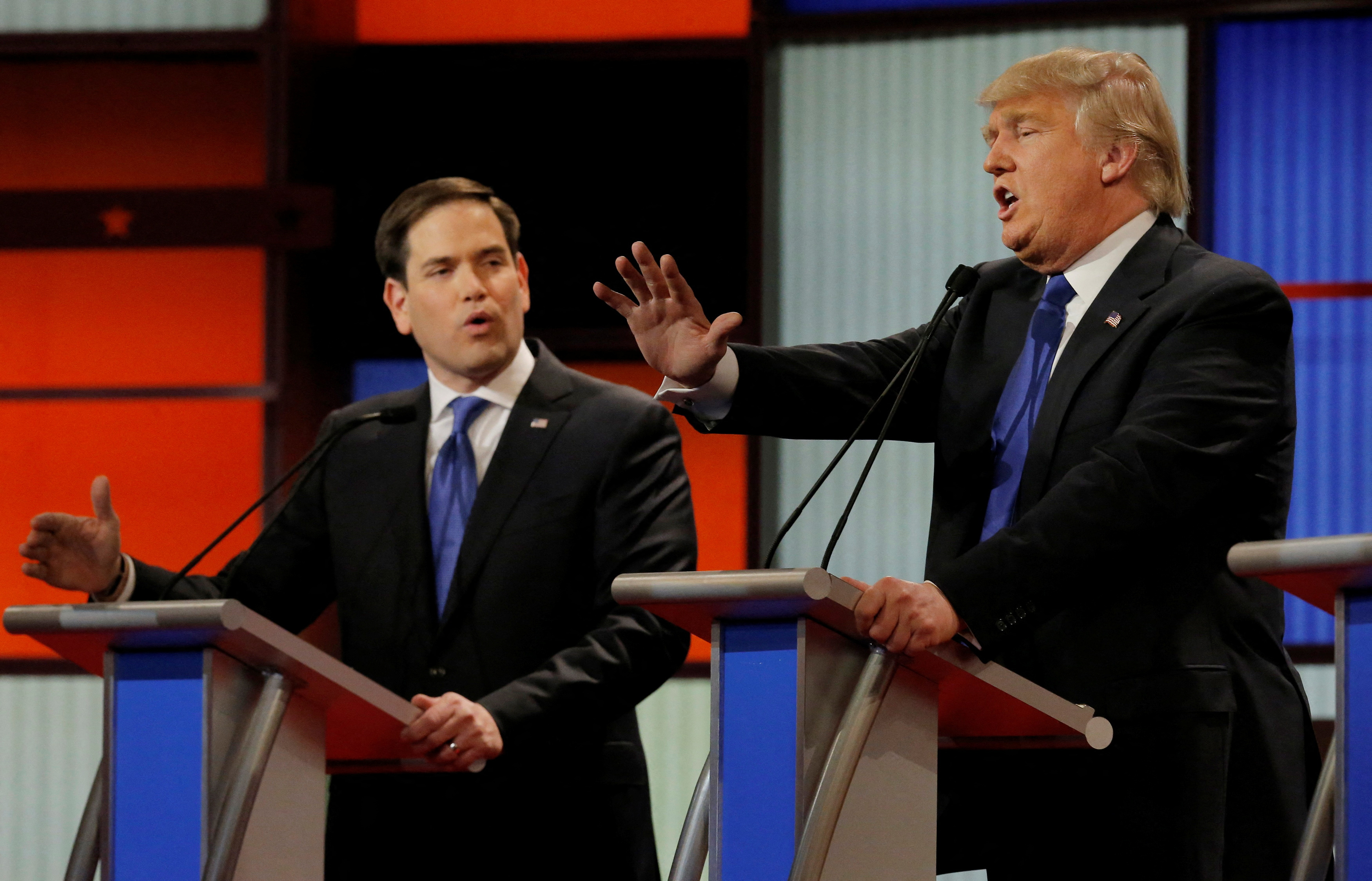 Republican U.S. presidential candidate Rubio and rival candidate Trump speak simultaneously at the U.S. Republican presidential candidates debate in Detroit