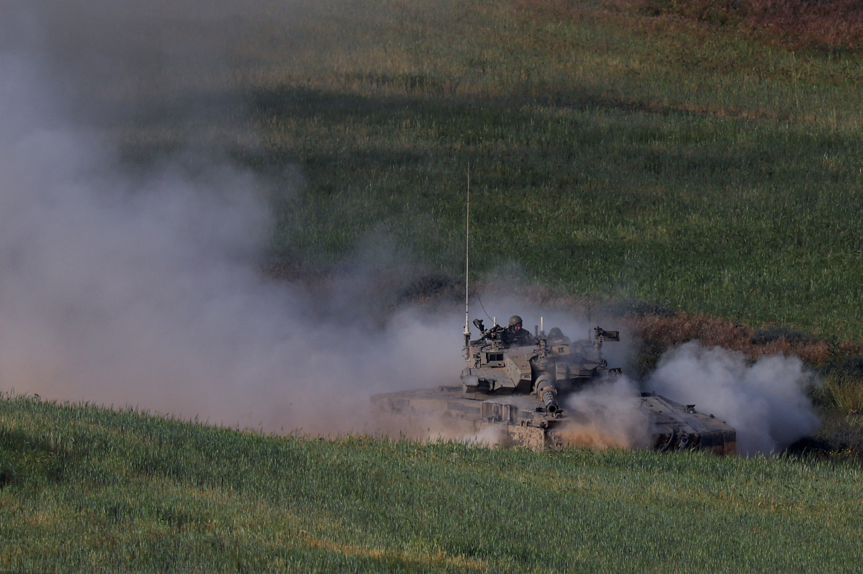 An Israeli tank manoeuvres near the Israel-Gaza border, in southern Israel