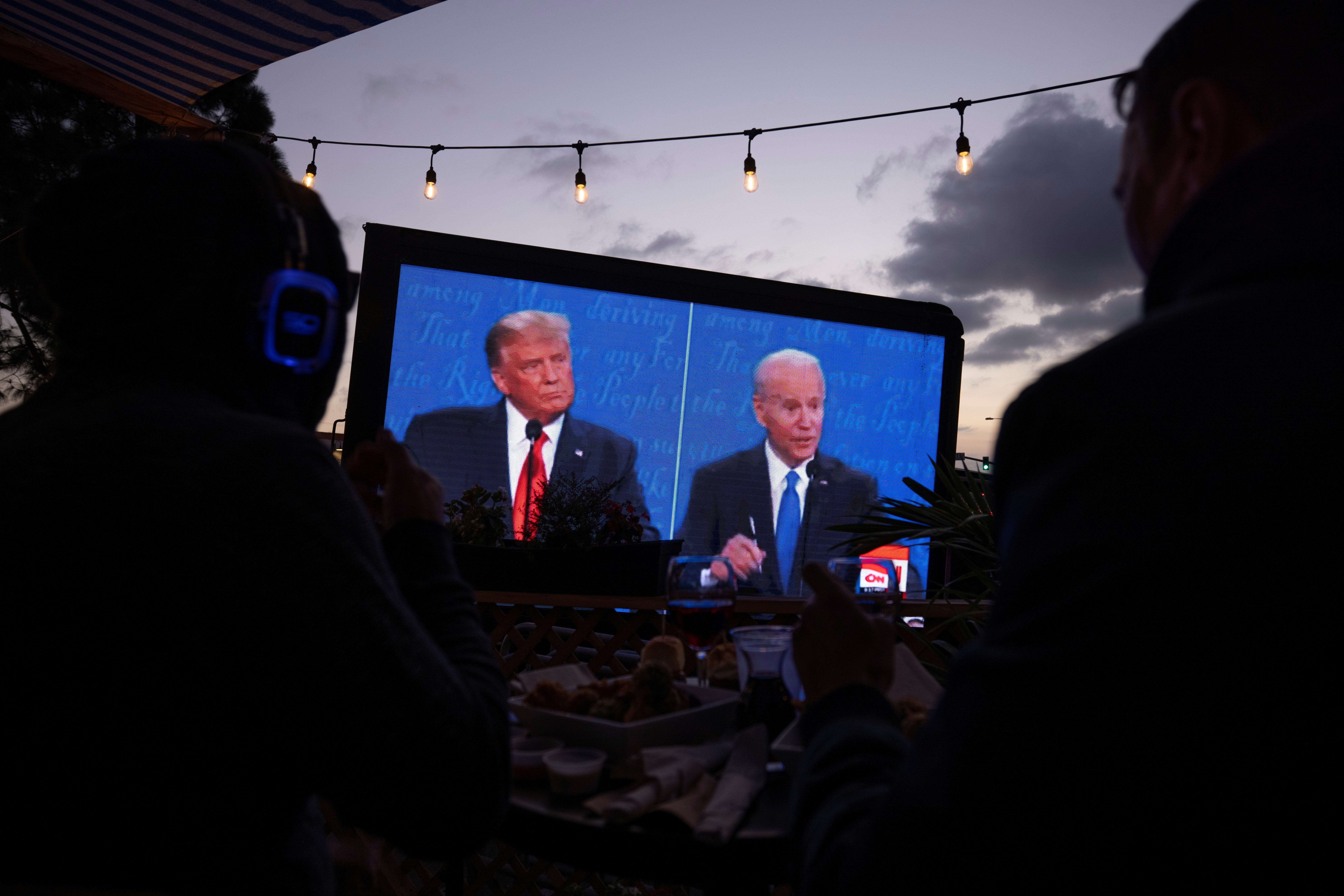 U.S. President Donald Trump and  Democratic presidential candidate Joe Biden's presidential debate is broadcast and watched at a tavern in San Diego
