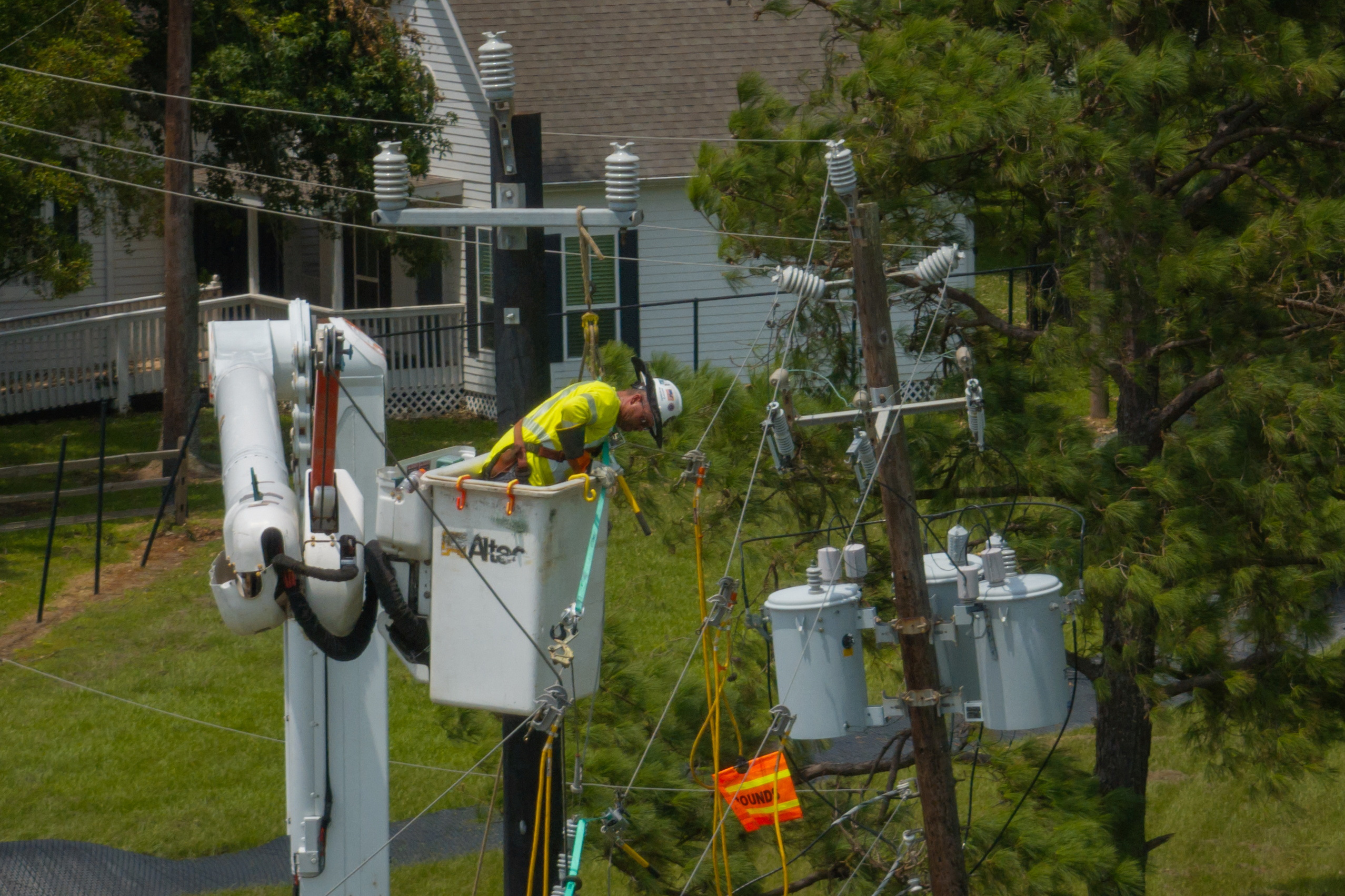 Worker repairs power lines in the aftermath of Hurricane Beryl in Seabrook, Texas