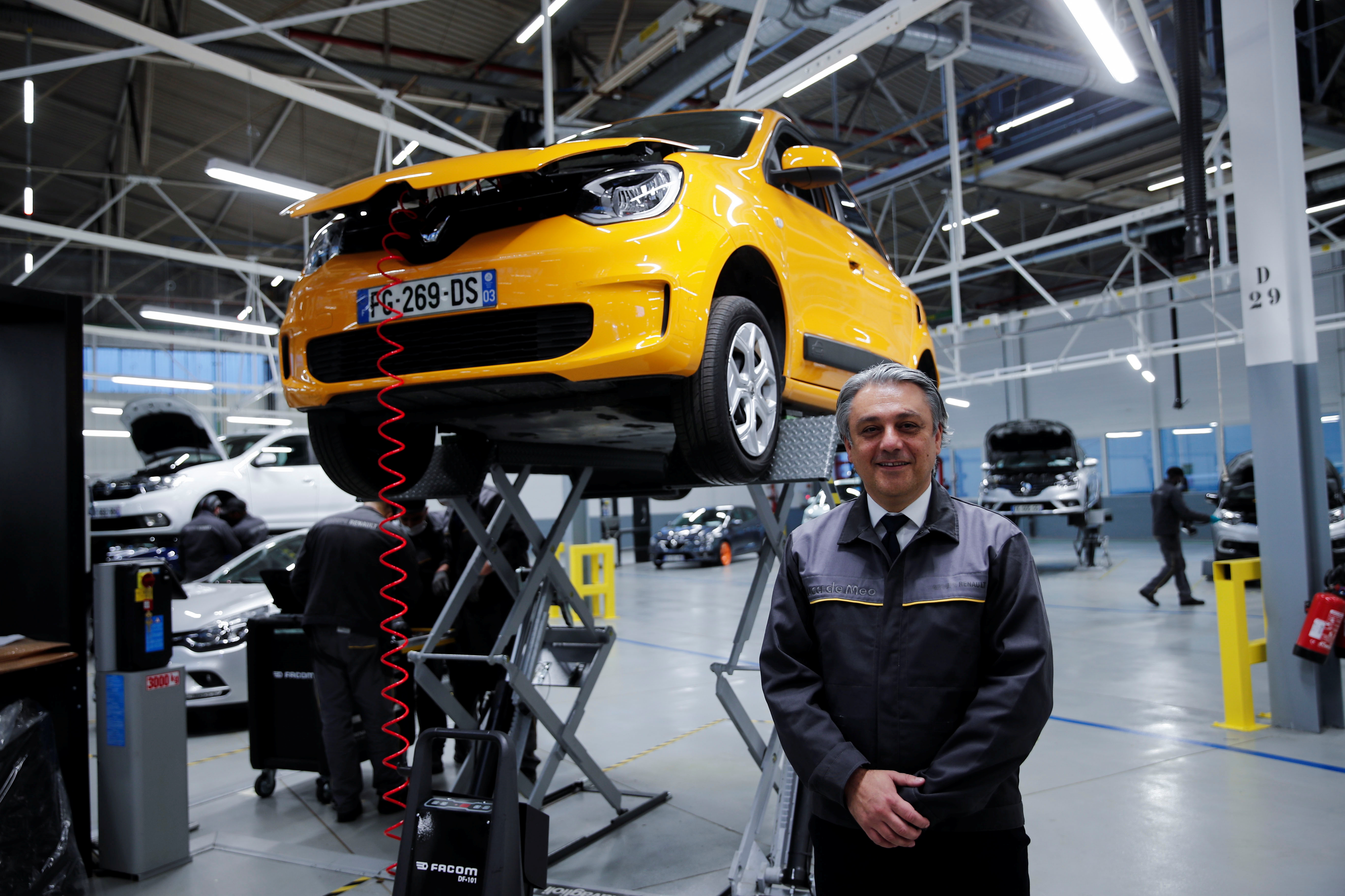 Renault Chief Executive Officer Luca de Meo poses after a news conference as part of a visit to present the Re-Factory, a second-hand vehicles' factory, in Flins, France, November 30, 2021. REUTERS/Benoit Tessier
