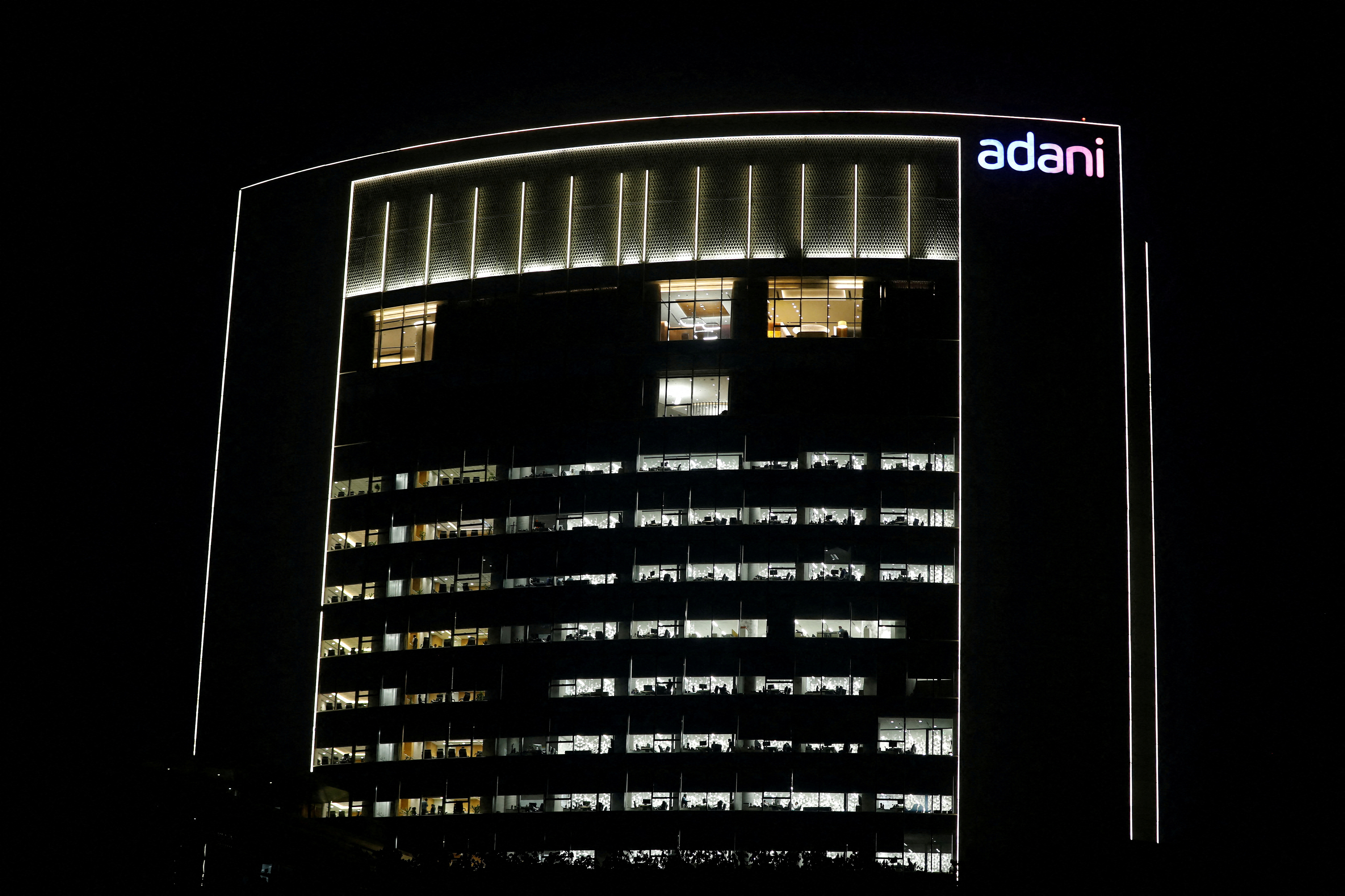 The logo of the Adani Group is seen on the facade of its Corporate House on the outskirts of Ahmedabad