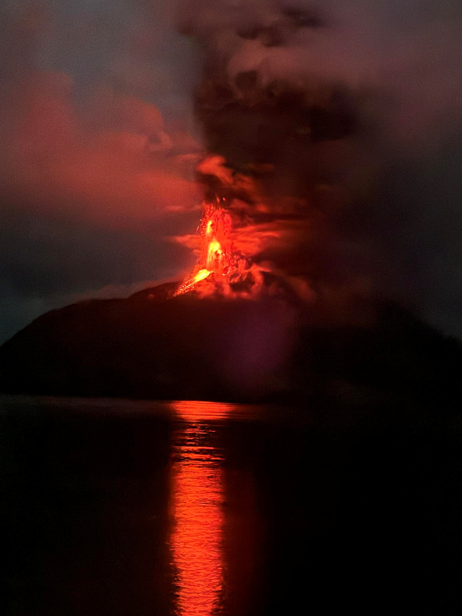 Mount Ruang volcano spews volcanic ash as seen from Siau Tagulandang Biaro