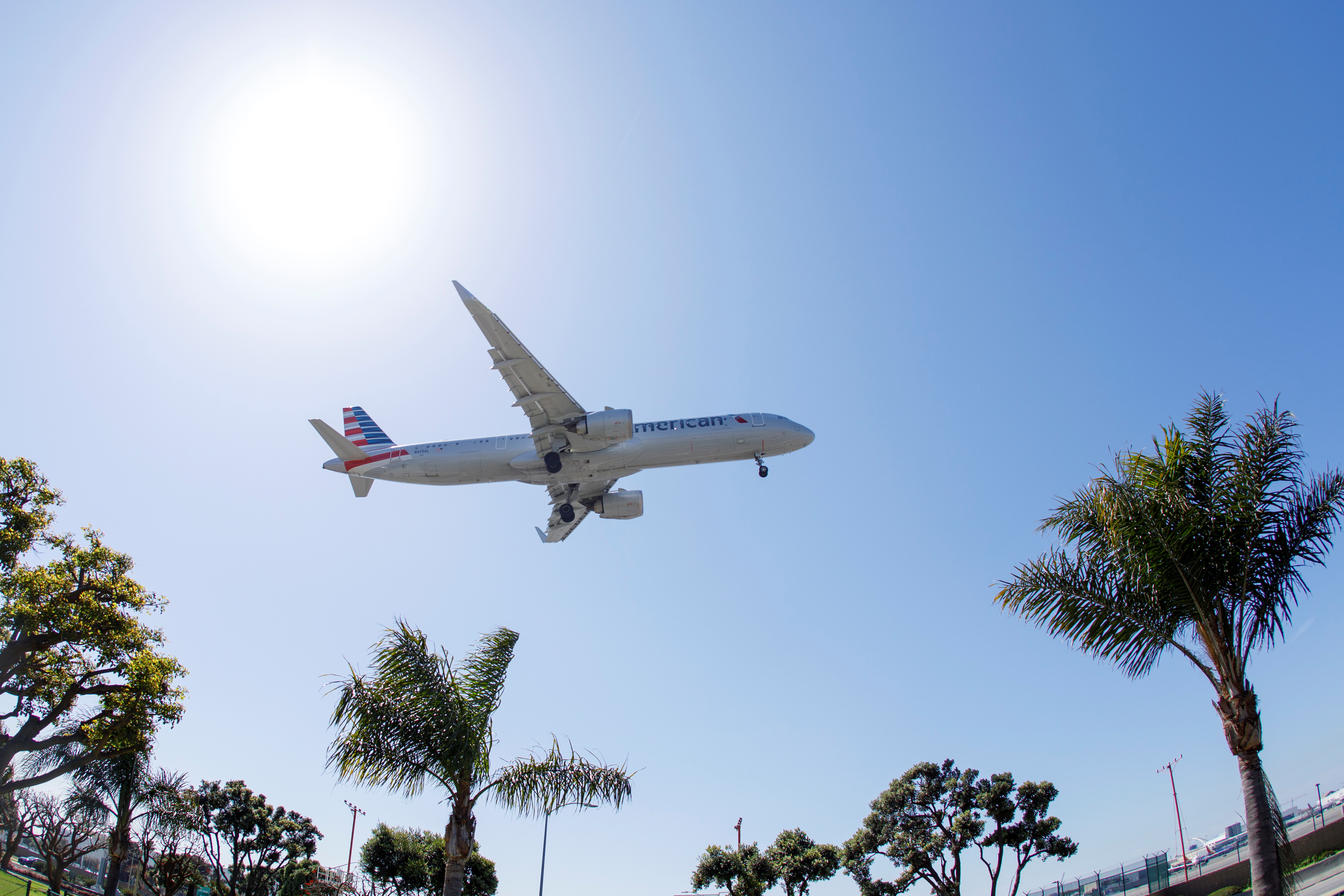 An American Airlines passenger jet approaches to land at LAX during the outbreak of the coronavirus disease (COVID-19) in Los Angeles, California, U.S., April 7, 2021. REUTERS/Mike Blake