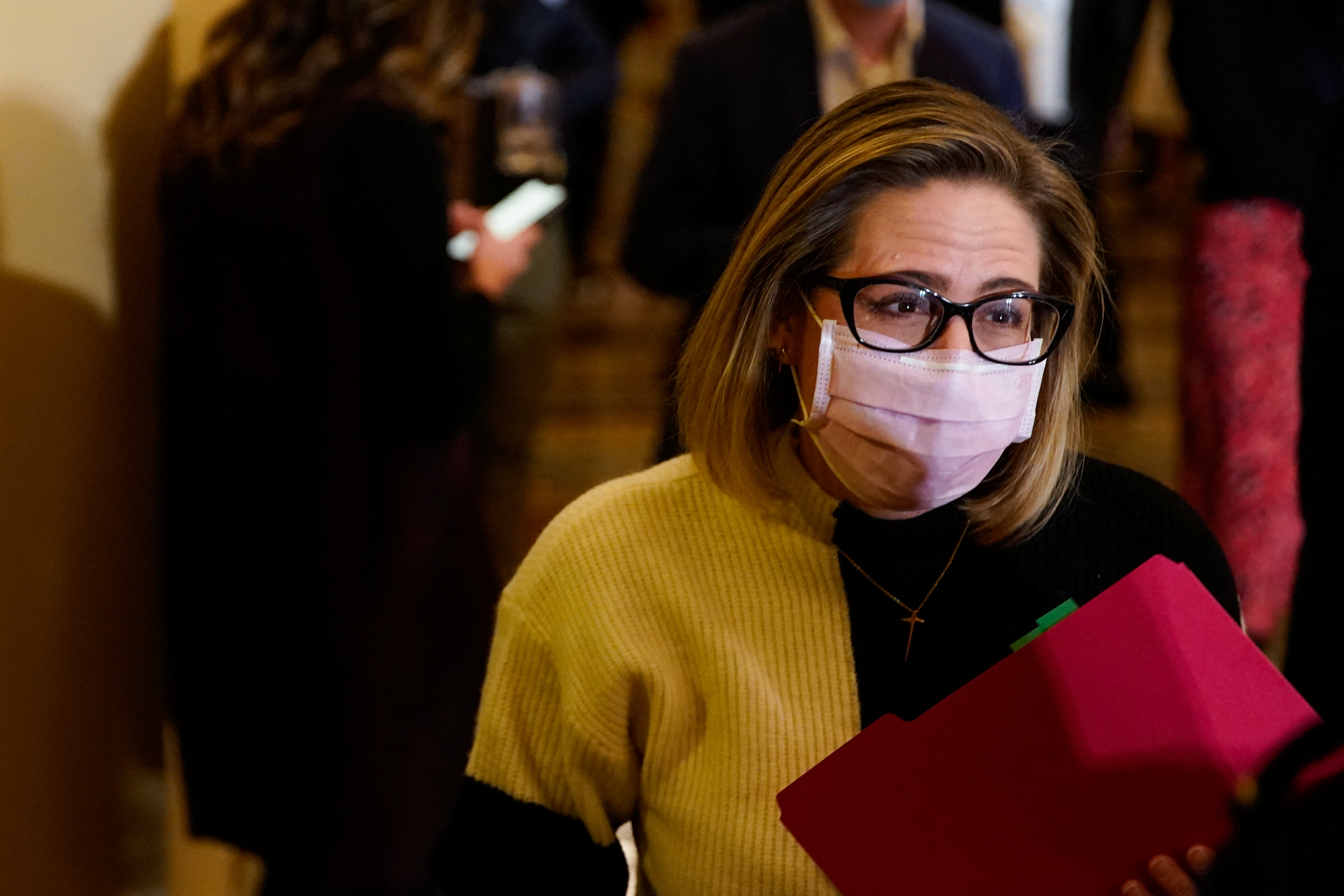 U.S. Senator Kyrsten Sinema (D-AZ) looks on following the Senate Democrats weekly policy lunch at the U.S. Capitol in Washington, U.S., December 7, 2021. REUTERS/Elizabeth Frantz