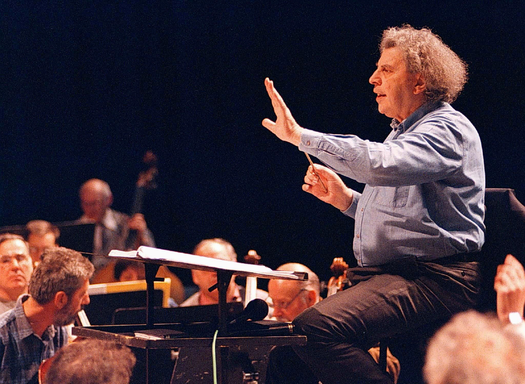 Greek composer Mikis Theodorakis conducts the Skopje's opera orchestra during a rehearsal in the Macedonian capital