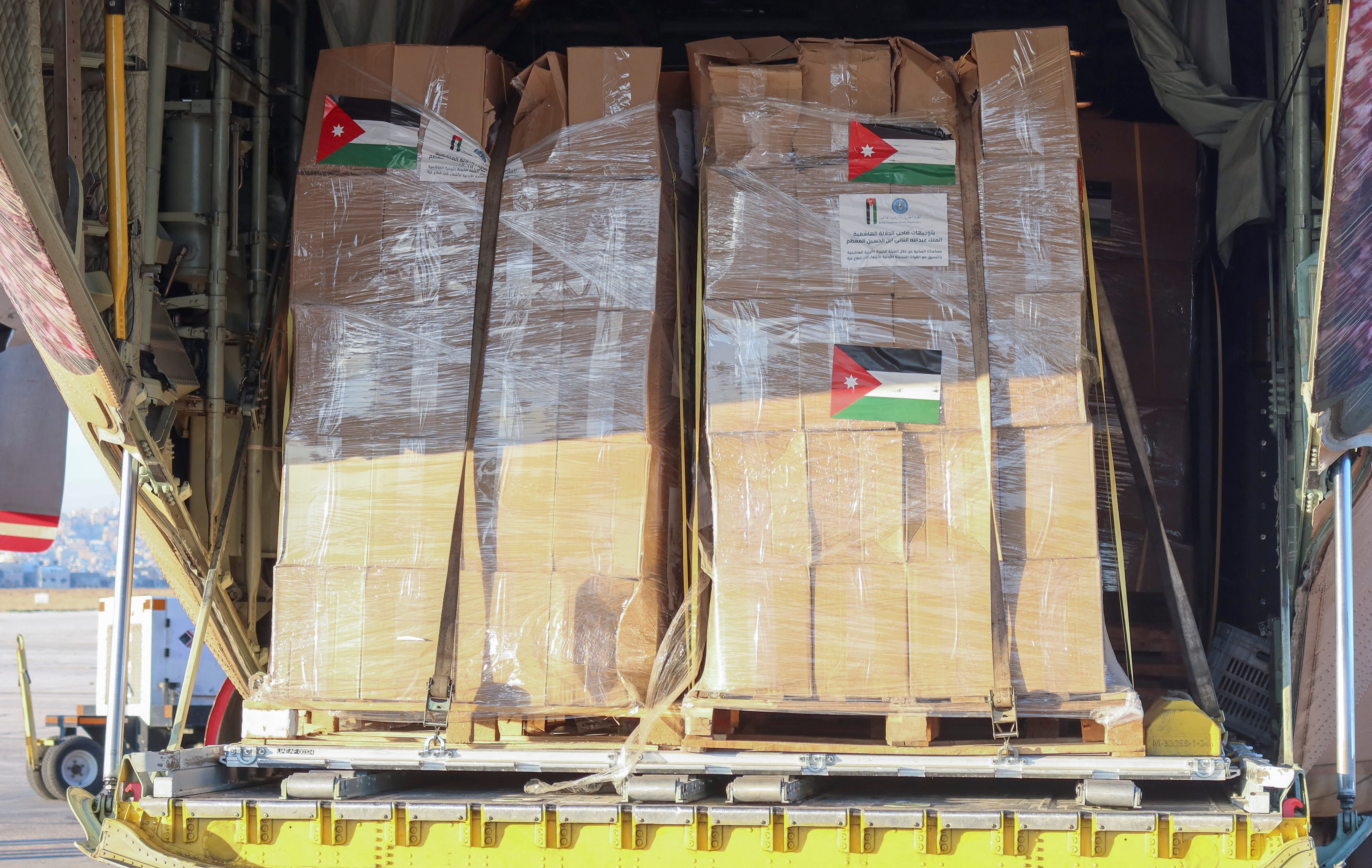 Humanitarian aid from Jordan Hashemite Charity Organization destined for the Gaza Strip is loaded inside a plane in Amman