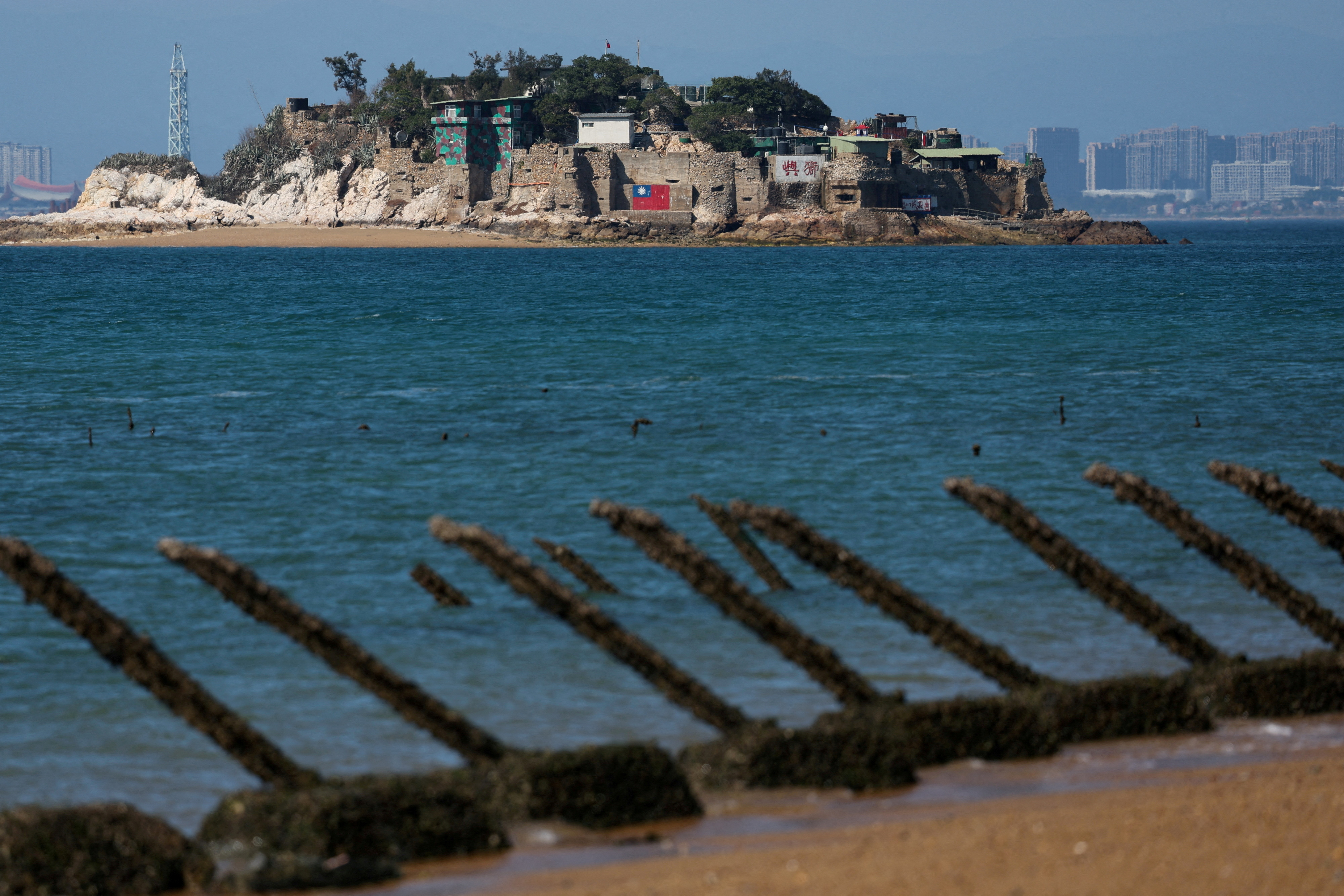 Shiyu or Lion Islet, which is part of Kinmen County, one of Taiwan's offshore islands, is pictured with China's Xiamen in the background, in Kinmen