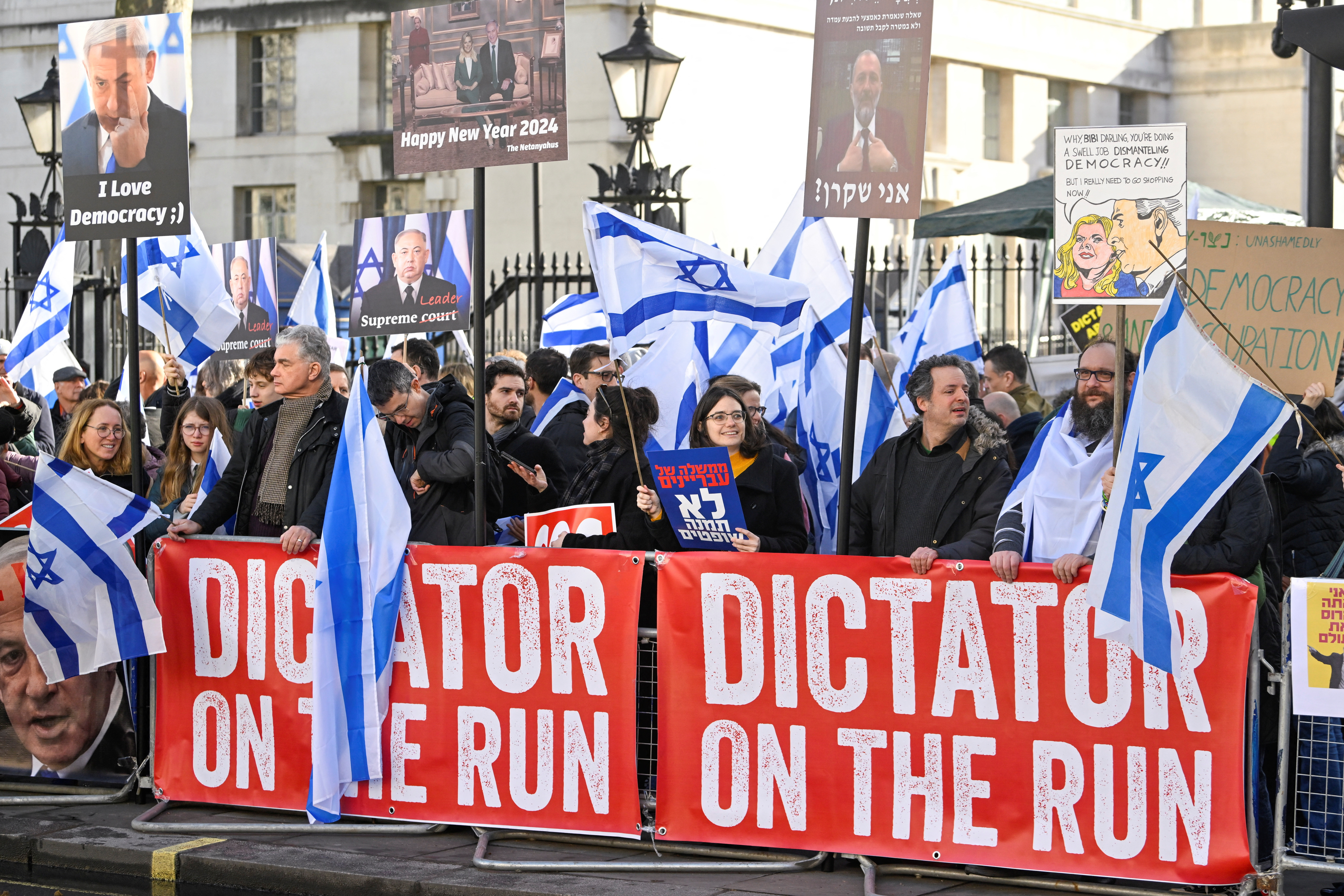 Demonstrators protest against Israeli Prime Minister Benjamin Netanyahu during his visit to Britain