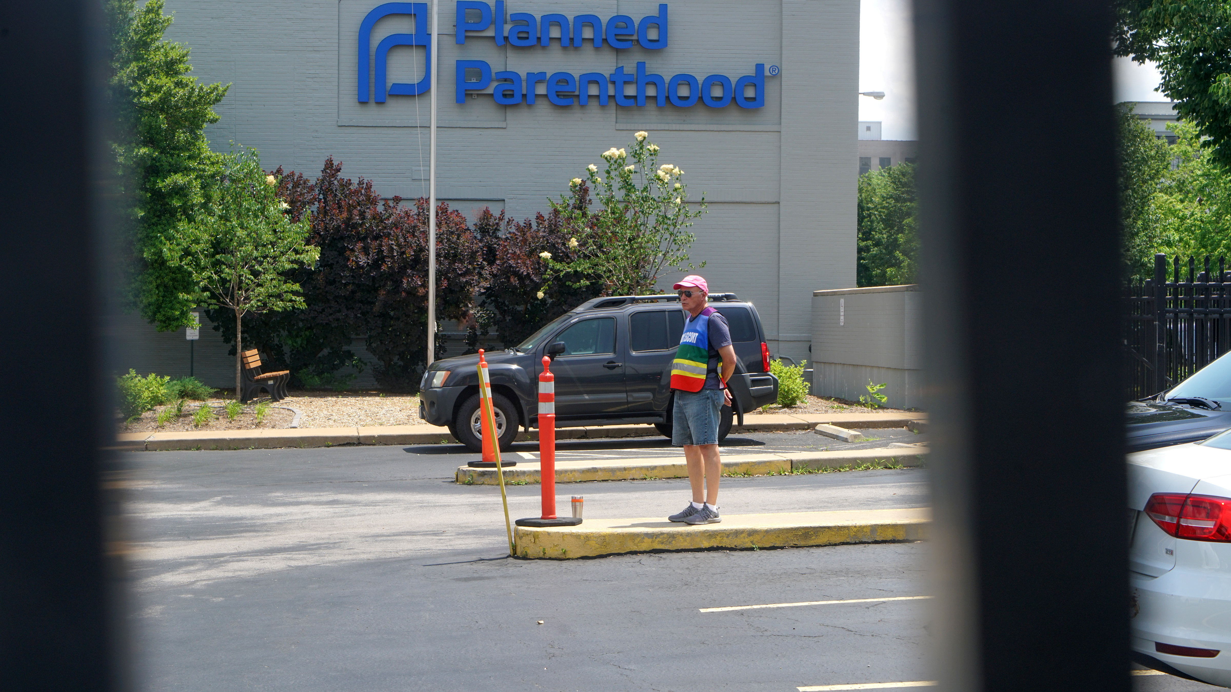 A clinic escort stands outside the Reproductive Health Services of Planned Parenthood in St. Louis