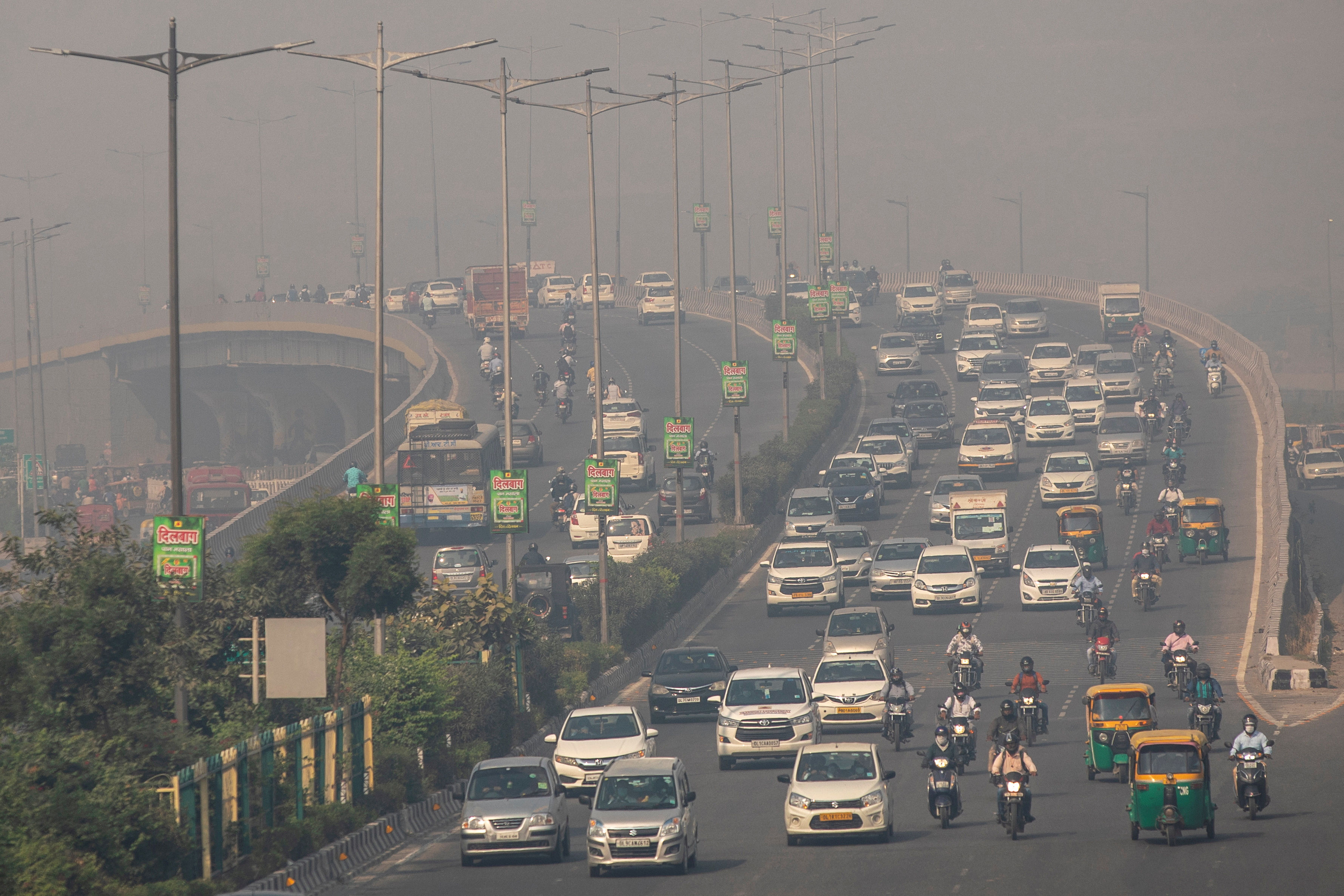 Traffic moves on a smoggy morning in New Delhi
