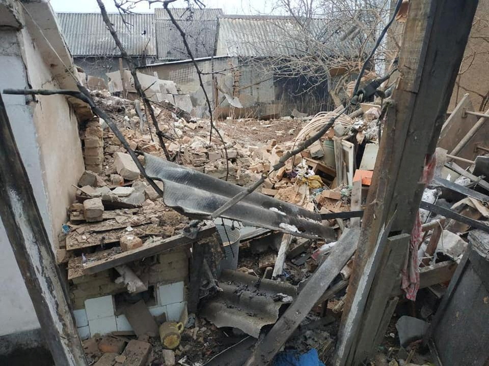 A view shows a damaged residential building in the town of Vrubivka
