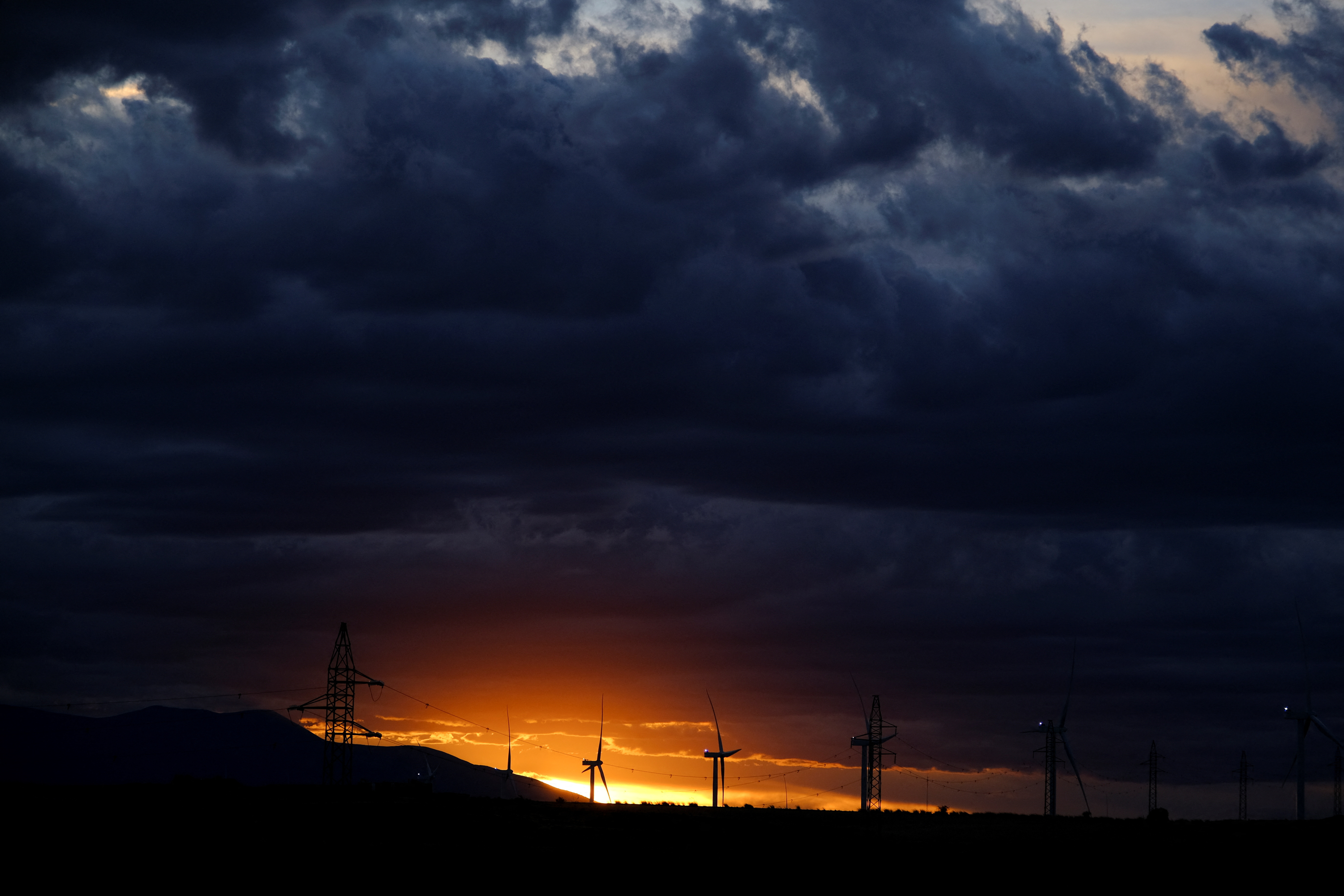 A view shows wind turbines during sunset in Alagon