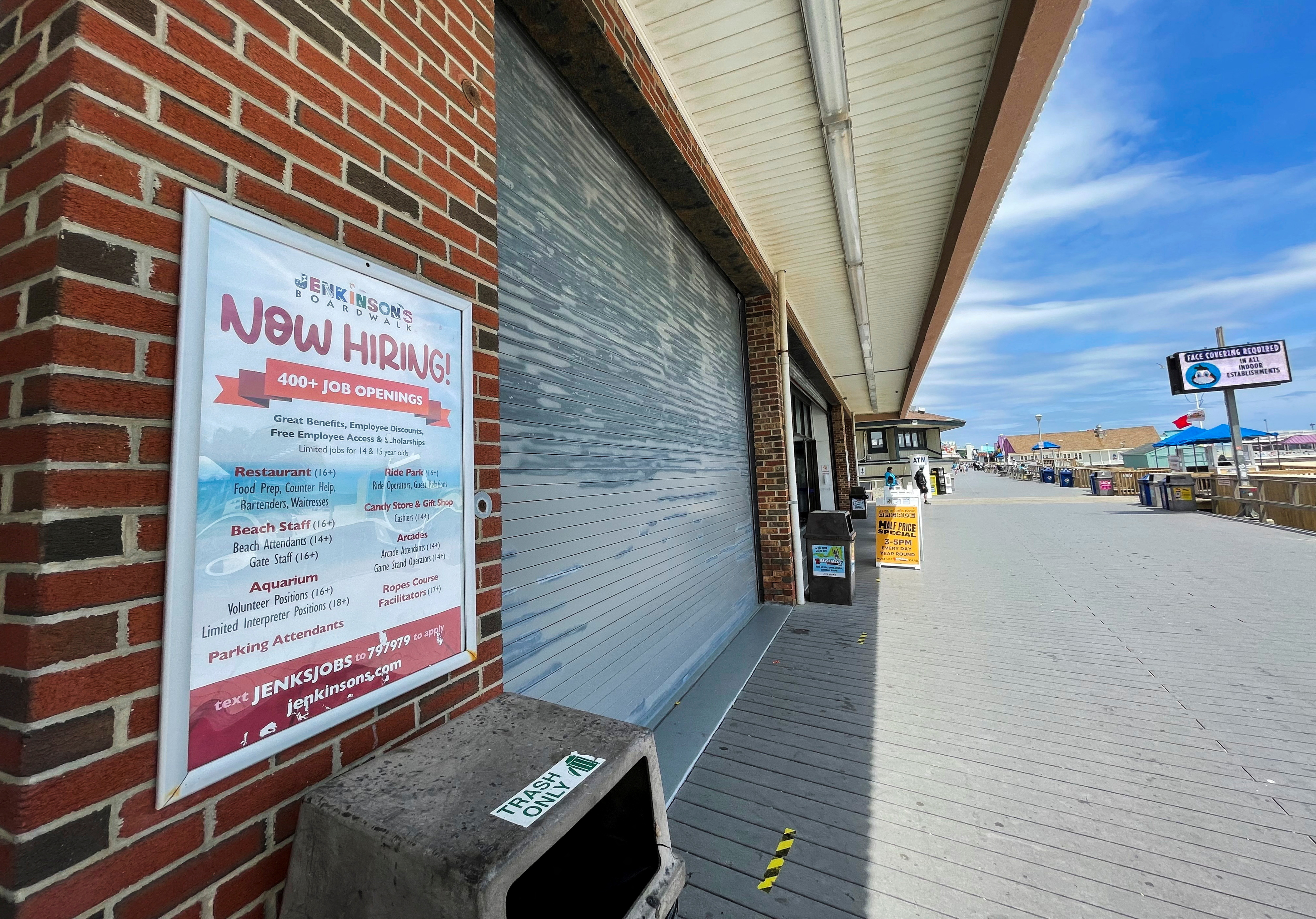 A sign advertising job openings at Jenkinson’s Boardwalk is posted in Point Pleasant Beach, New Jersey