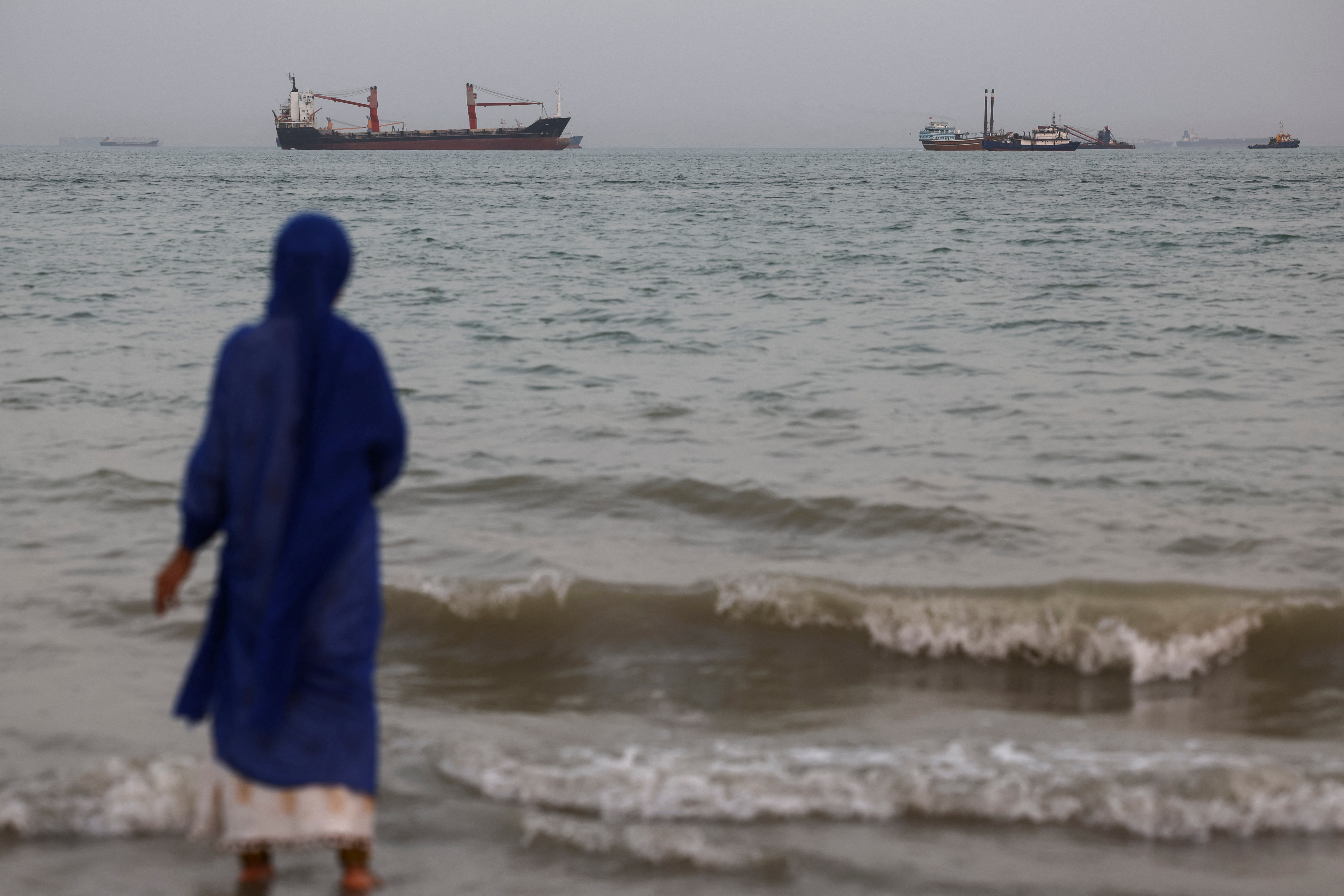 Vessels in the Strait of Hormuz are visible near the beach of Bandar Abbas, Iran on May 22, 2026. &mdash; WANA via Reuters