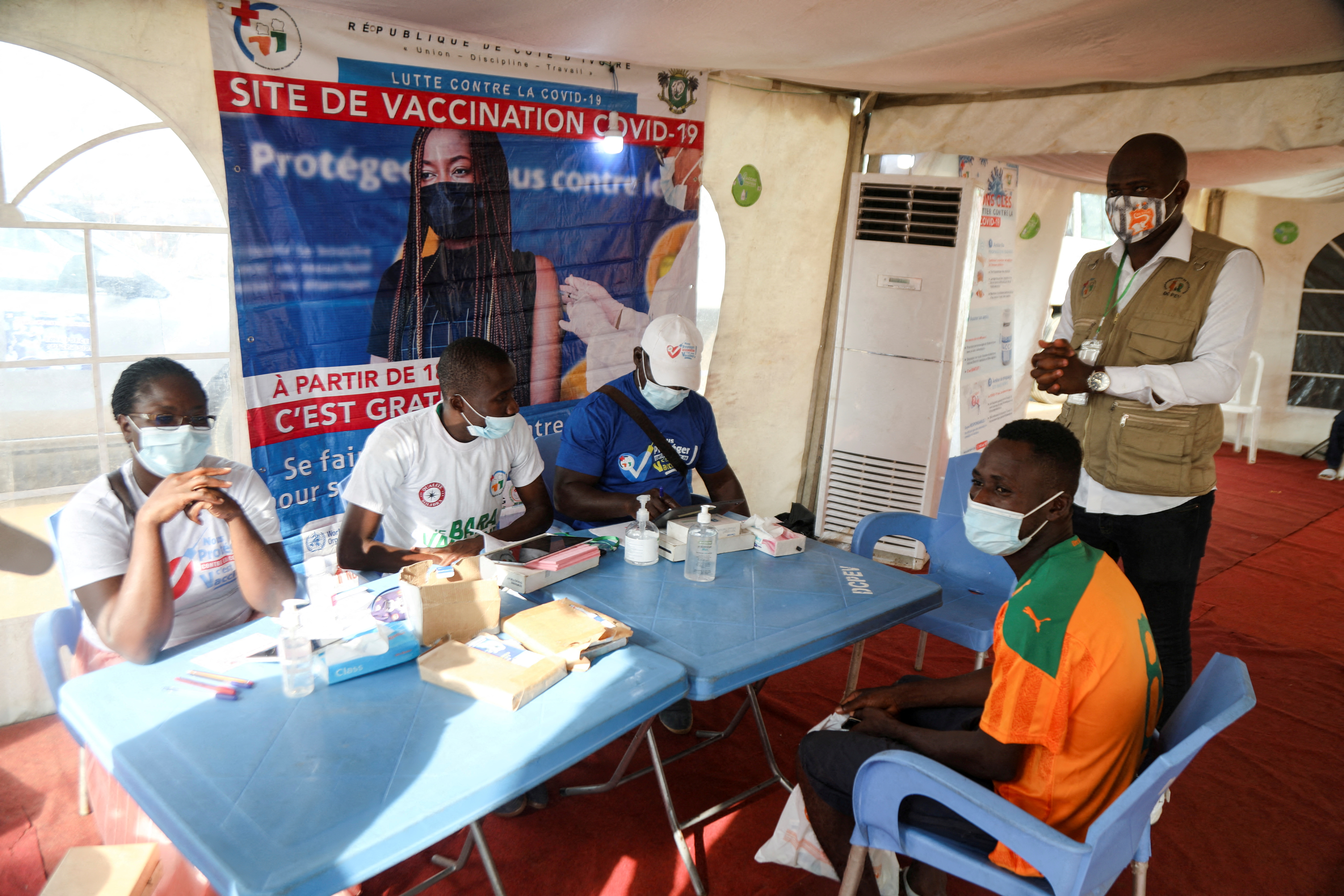 Abidjan soccer fans get the vaccinated against the coronavirus disease (COVID-19) to watch their team play in Abidjan