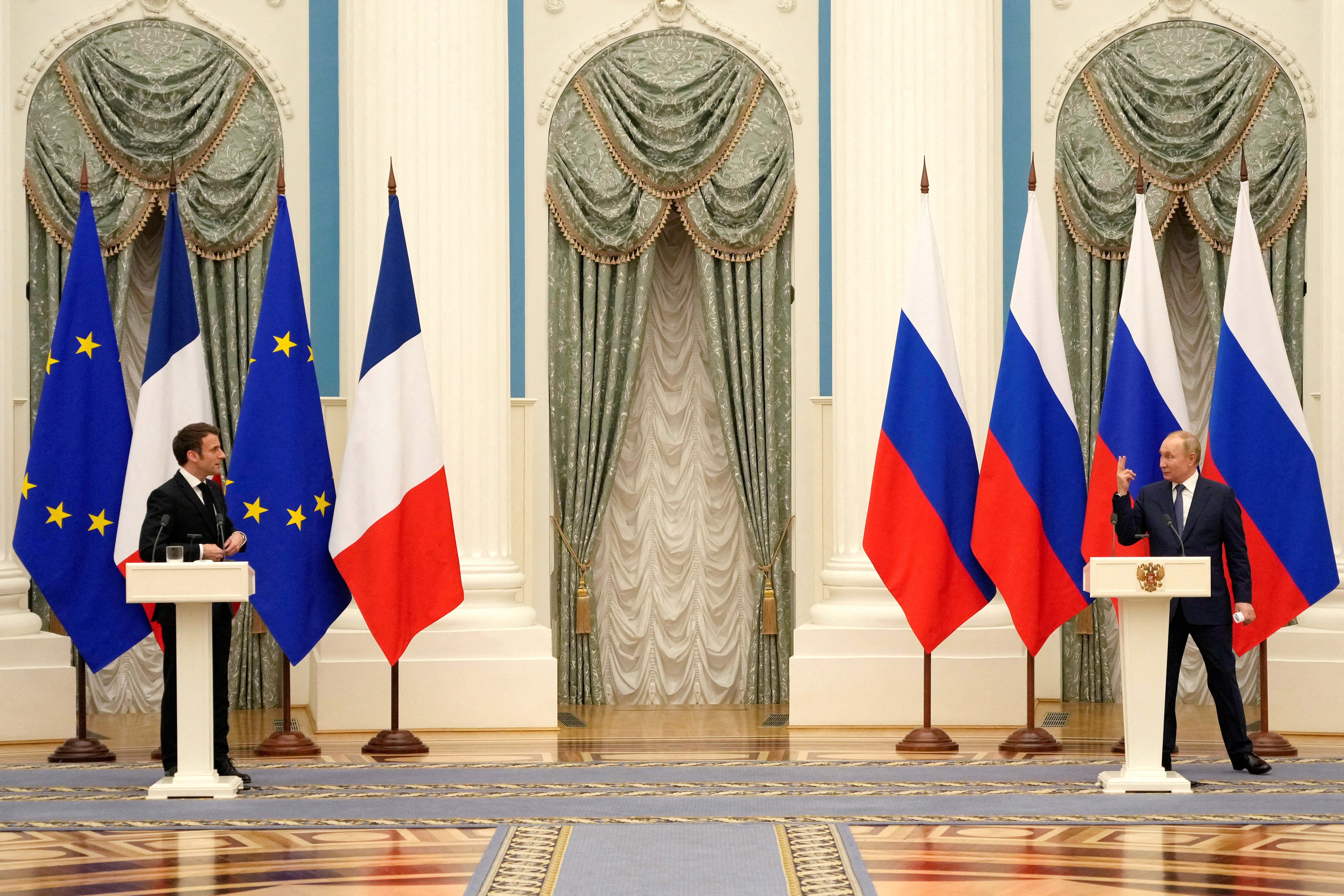 Russian President Vladimir Putin and French President Emmanuel Macron, attend a joint press conference, in Moscow, Russia, February 7, 2022. Thibault Camus/Pool via REUTERS