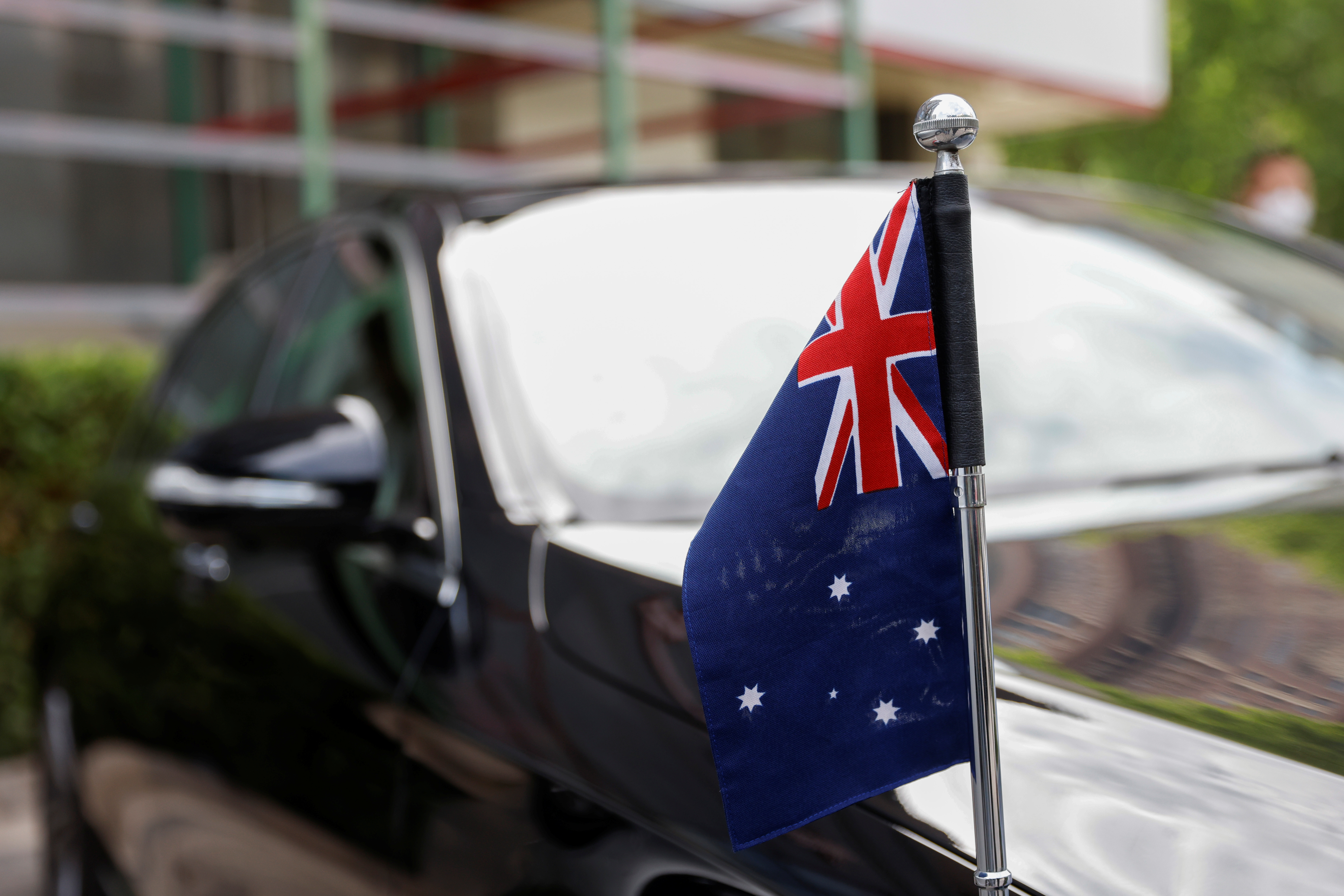 An Australian flag is seen on the car of Australia's Ambassador to China, Graham Fletcher, after he was not granted access to the Beijing No. 2 Intermediate People's Court, in Beijing