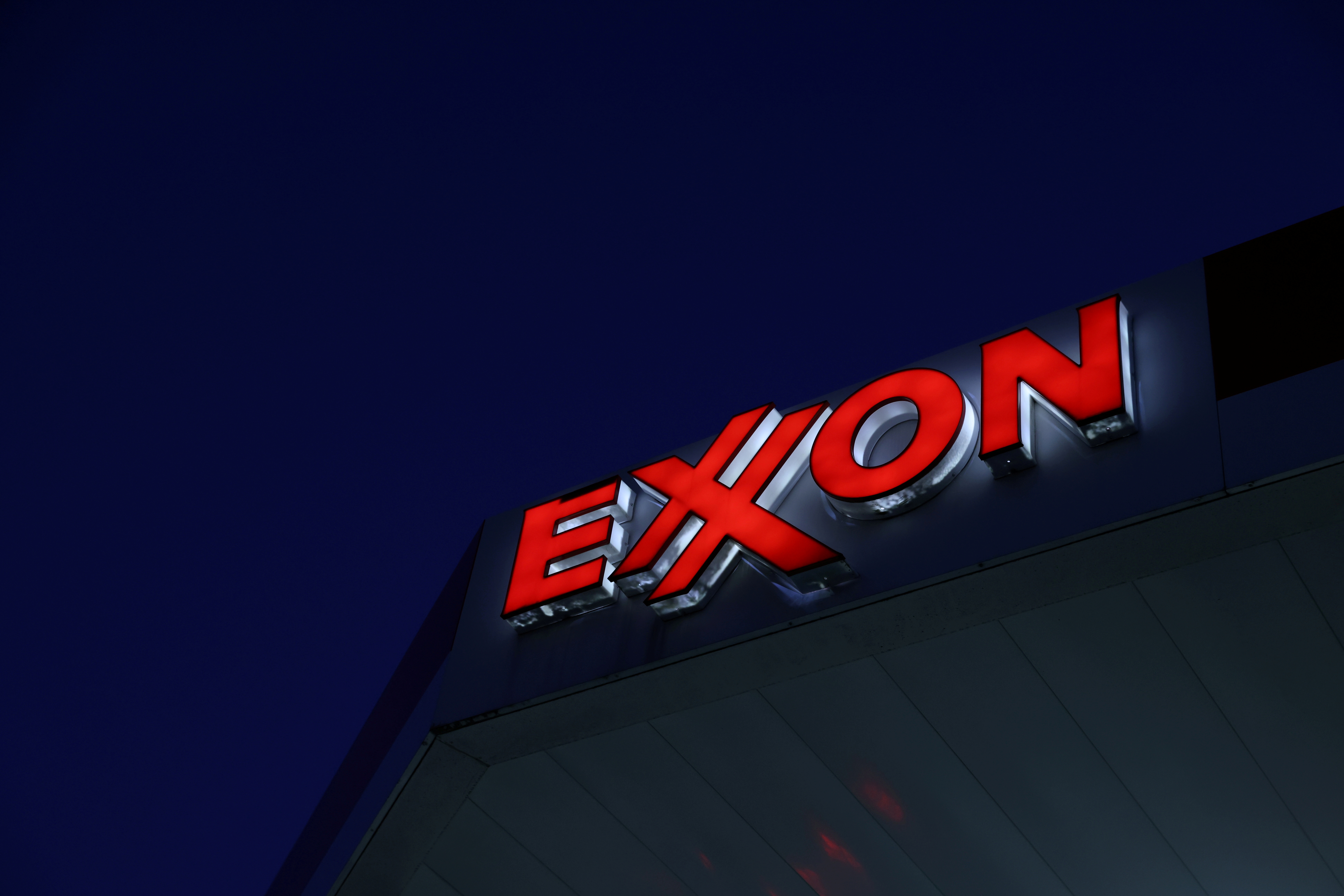 Signage is seen at an Exxon gas station in Brooklyn, New York City