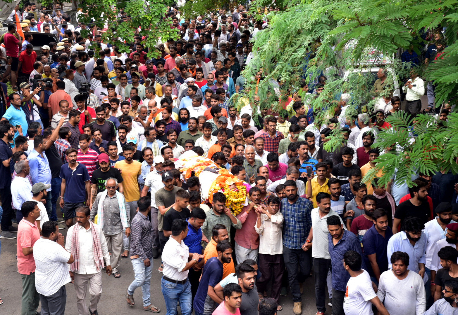 People carry the body of a Hindu man for his cremation in Udaipur