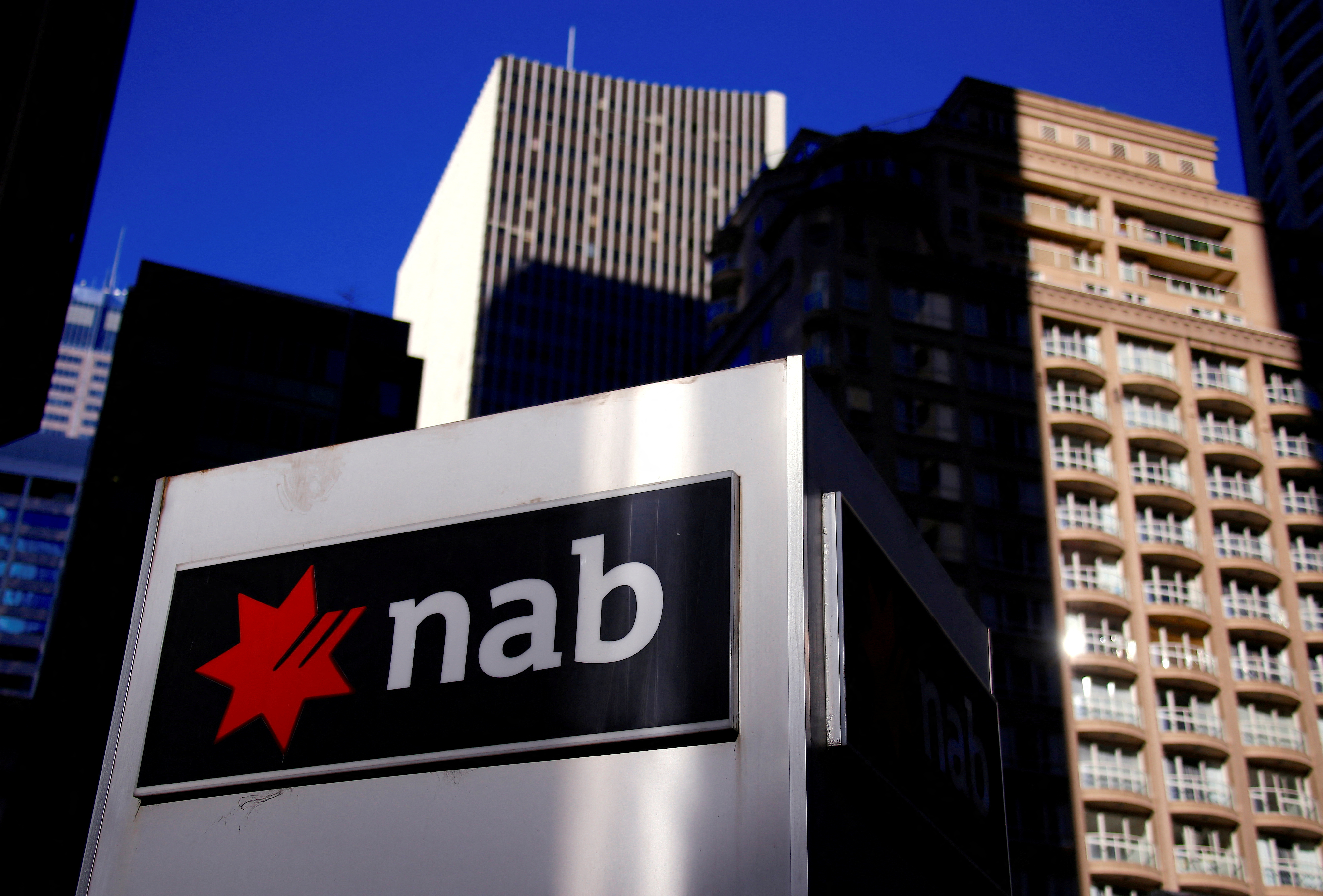 The logo of National Australia Bank is displayed outside the firm's headquarters in central Sydney