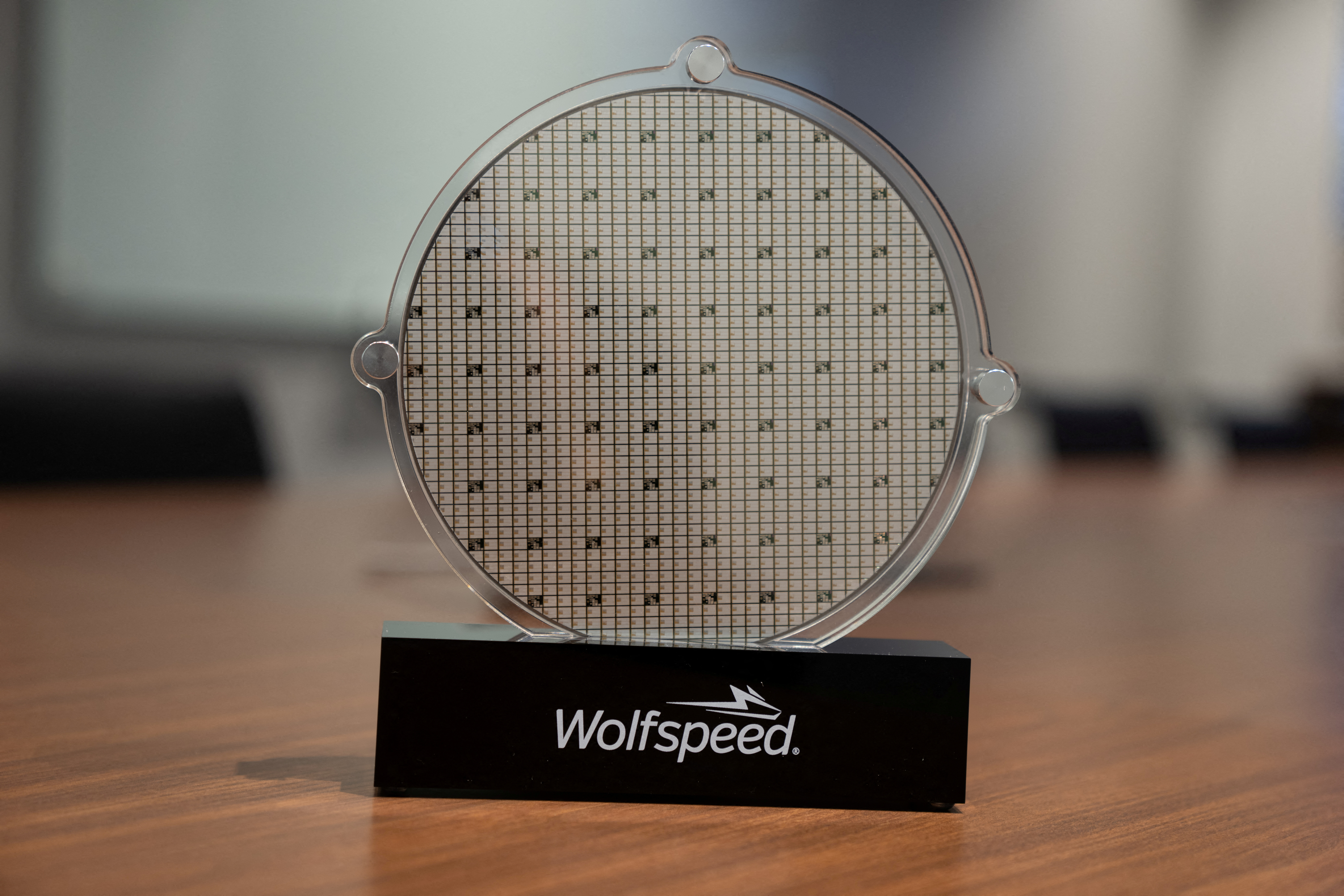 U.S. power chip maker Wolfspeed’s silicon carbide 200mm wafer is seen on display at Wolfspeed’s Mohawk Valley Fab in Marcy, New York, U.S., April 2022. Silicon carbide power chips have been gaining traction with electric car makers as they