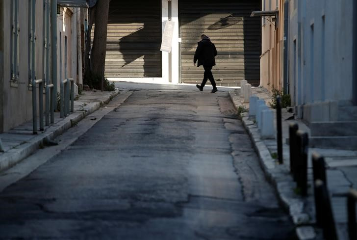 A man walks on a street following the coronavirus disease (COVID-19) outbreak in Athens