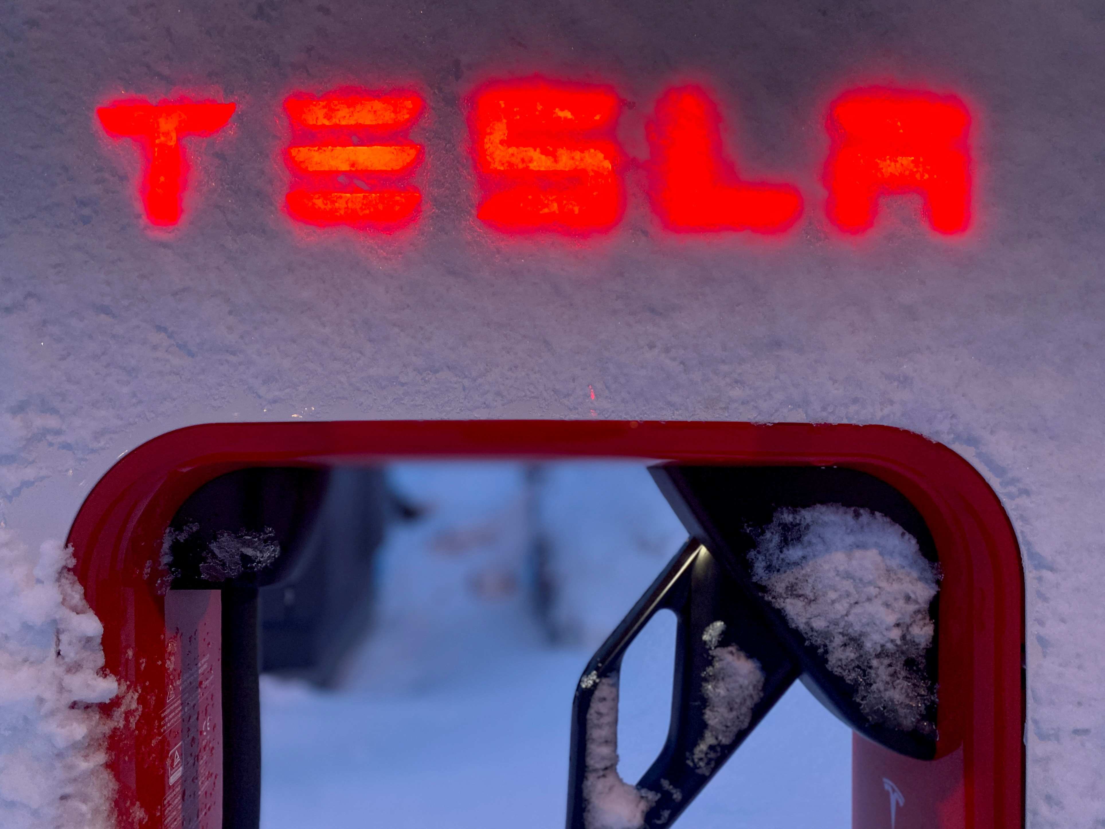 Tesla electric vehicle charger is seen during the winter in Hofn