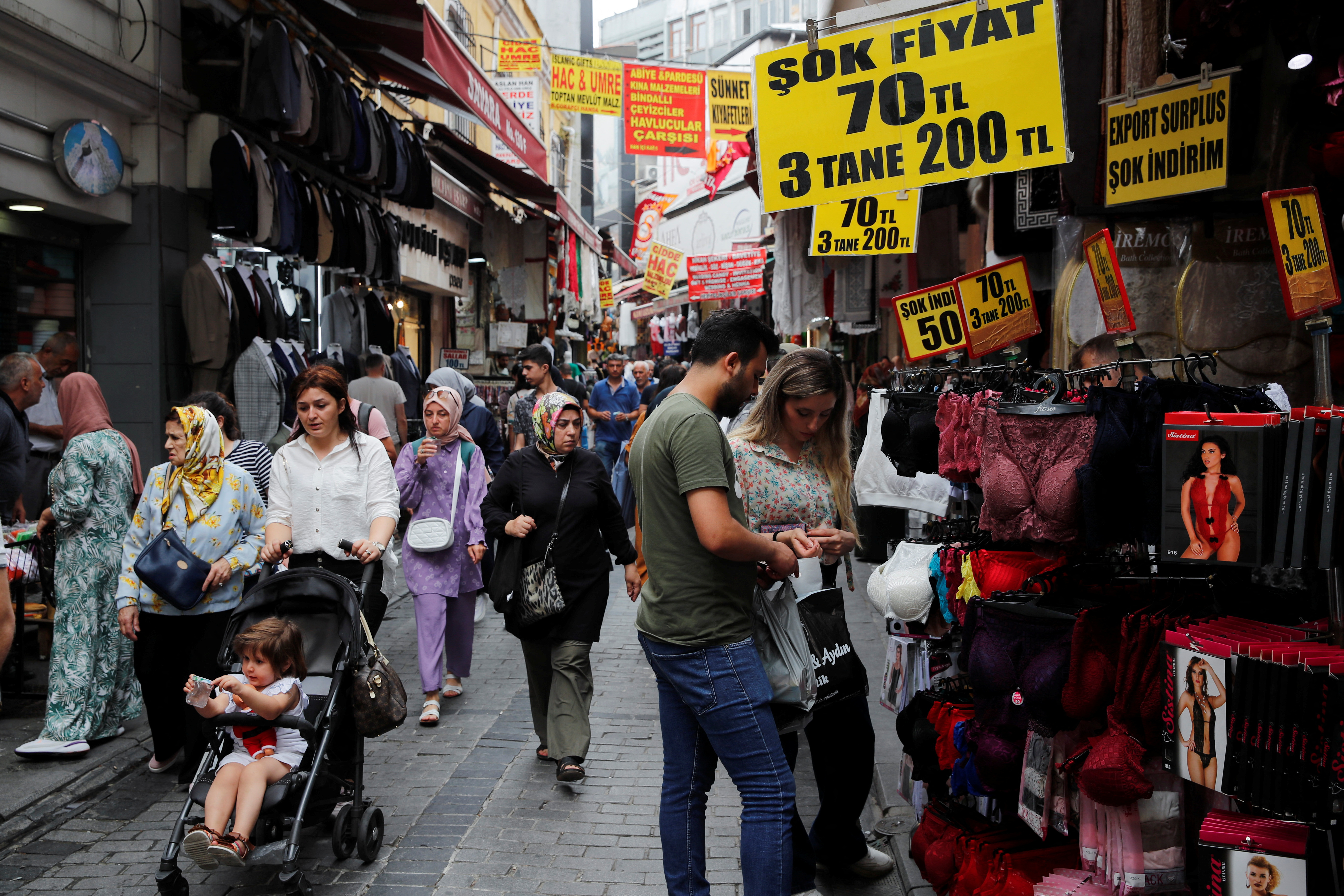 People stroll in a middle-class shopping area in Istanbul