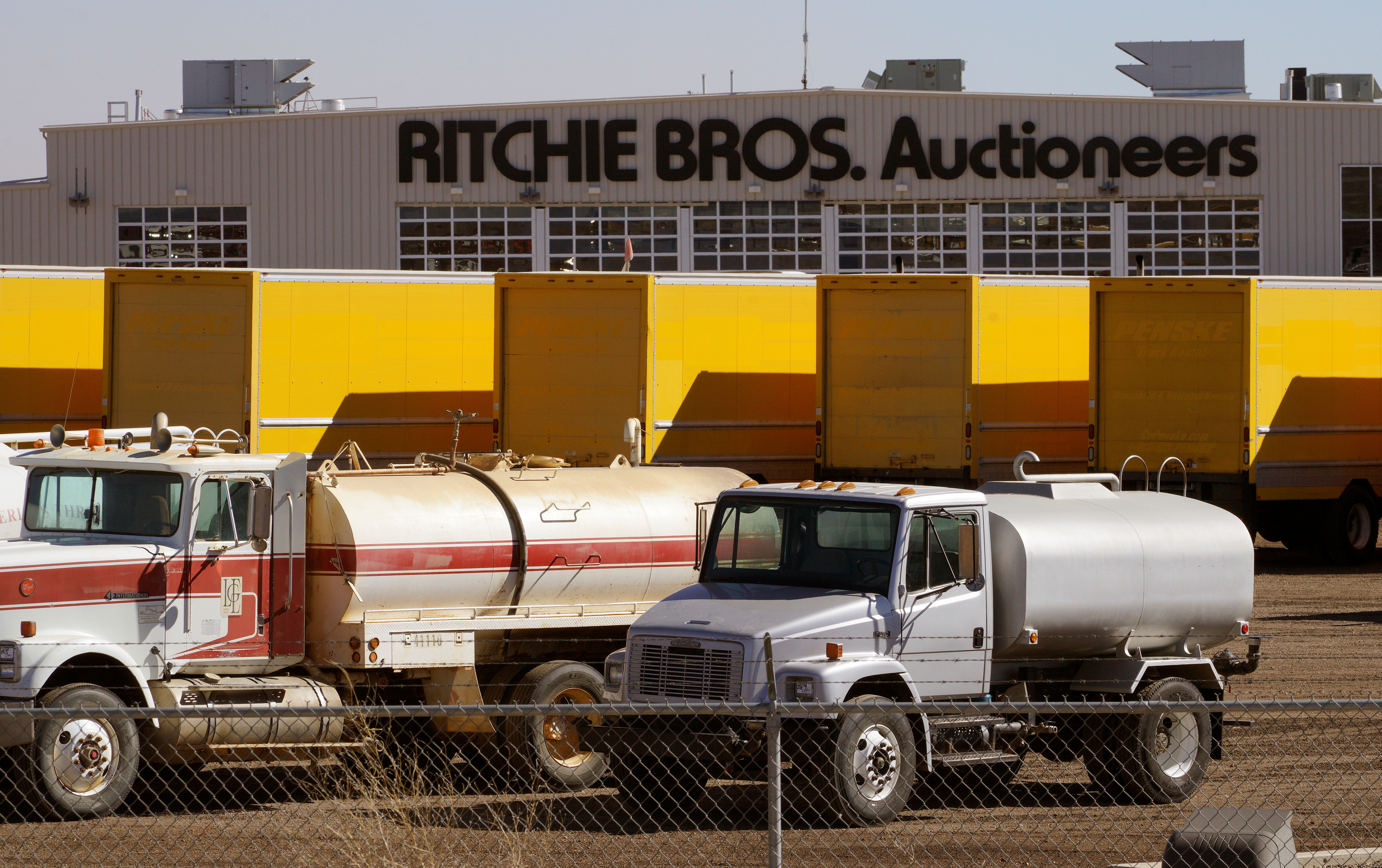 Vehicles to be sold in the next auction are lined up outside Ritchie Bros. Auctioneers in Longmont