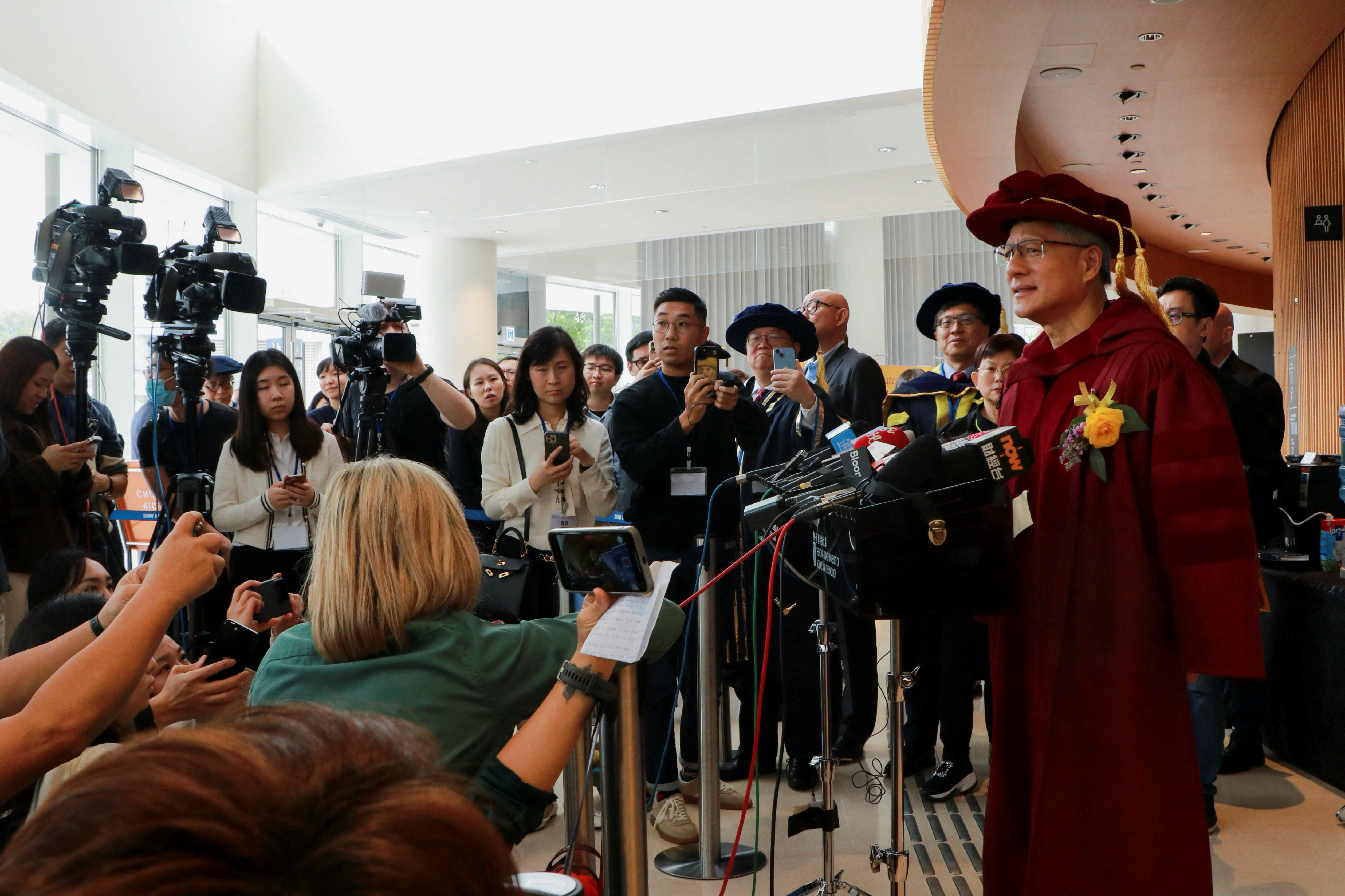 CEO of Nvidia Jensen Huang speaks to the media after receiving an honorary degree from Hong Kong University of Science and Technology in Hong Kong