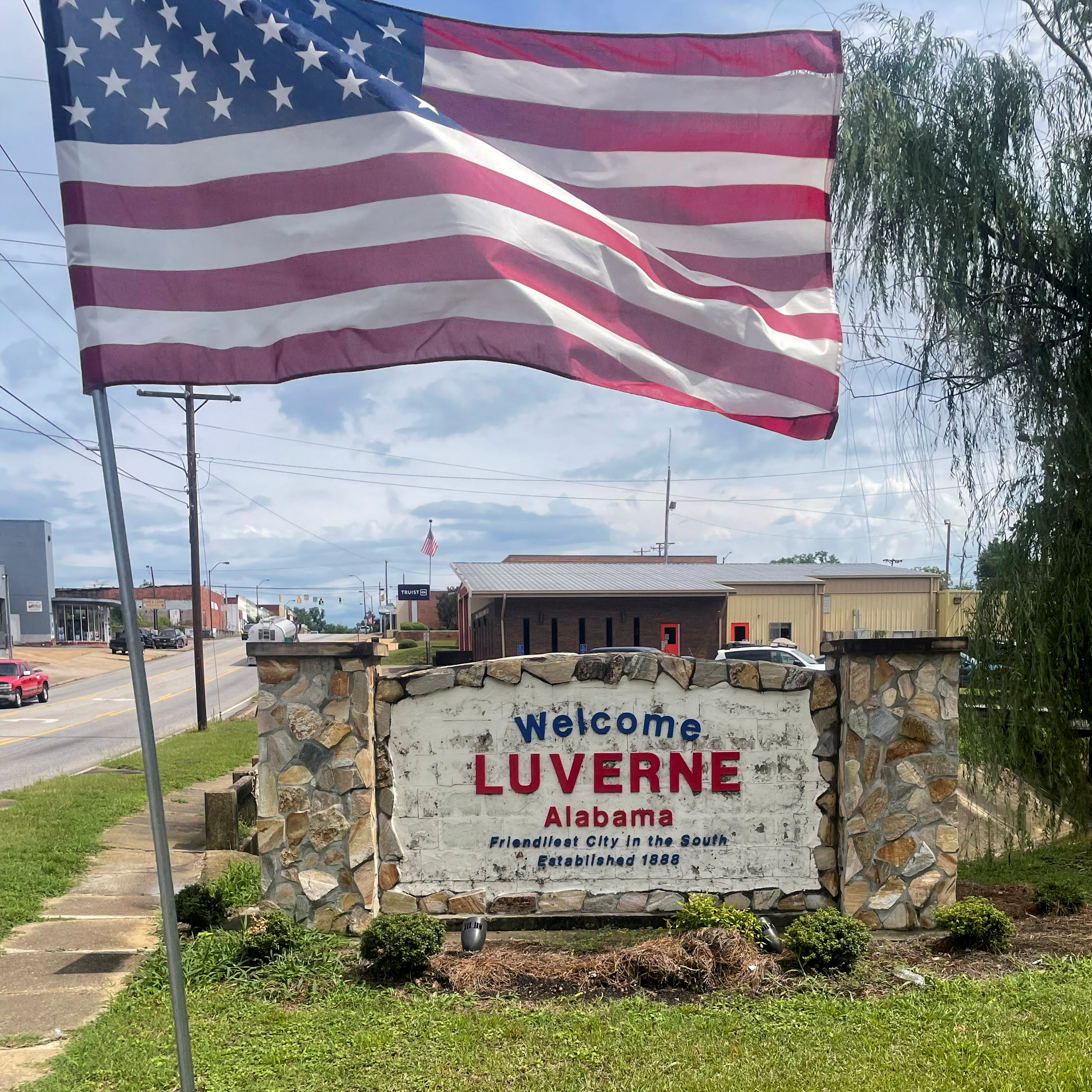 U.S. flag flies above a welcome sign in Luverne