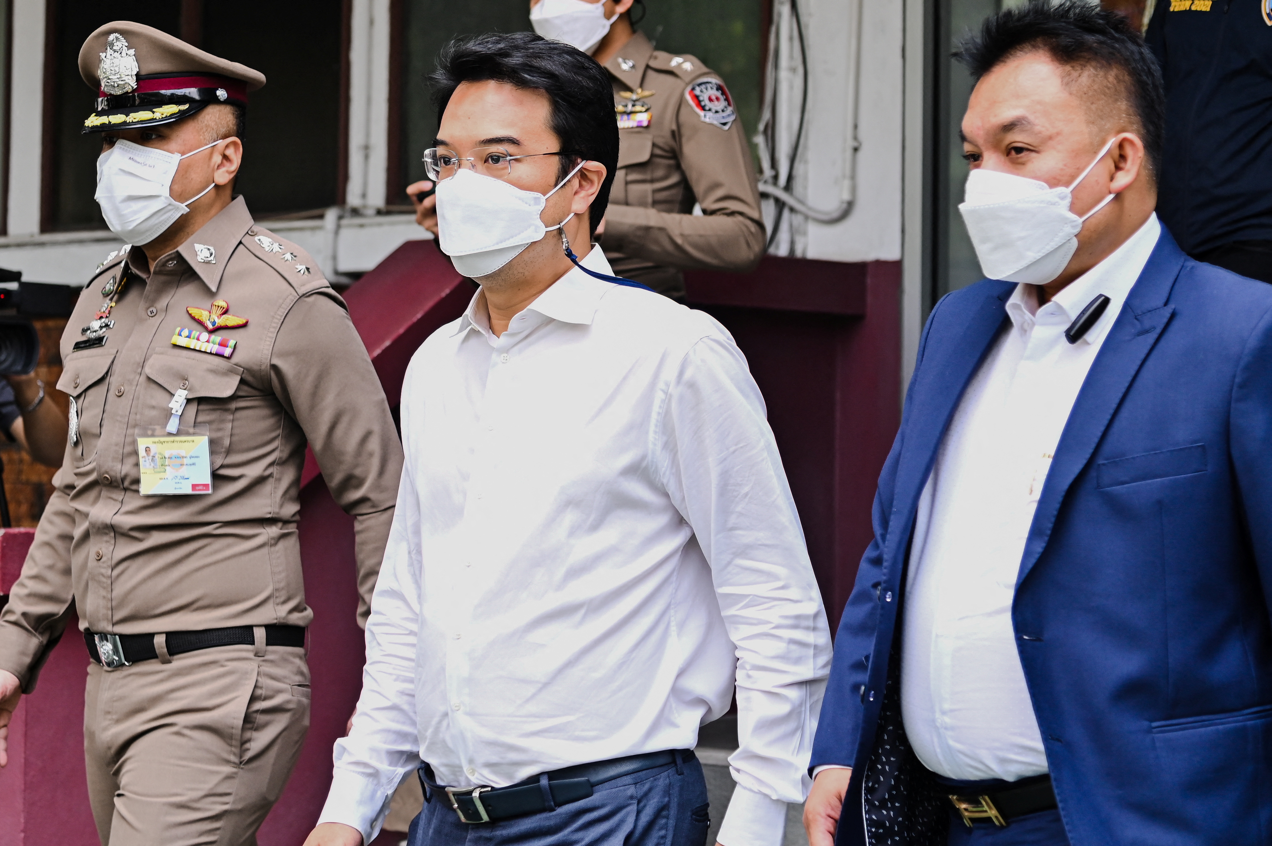 Prinn Panitchpakdi, a former deputy leader of Thailand's Democrat party, facing allegations of sexual misconduct and rape, offences he has previously denied, leaves a police station in Bangkok