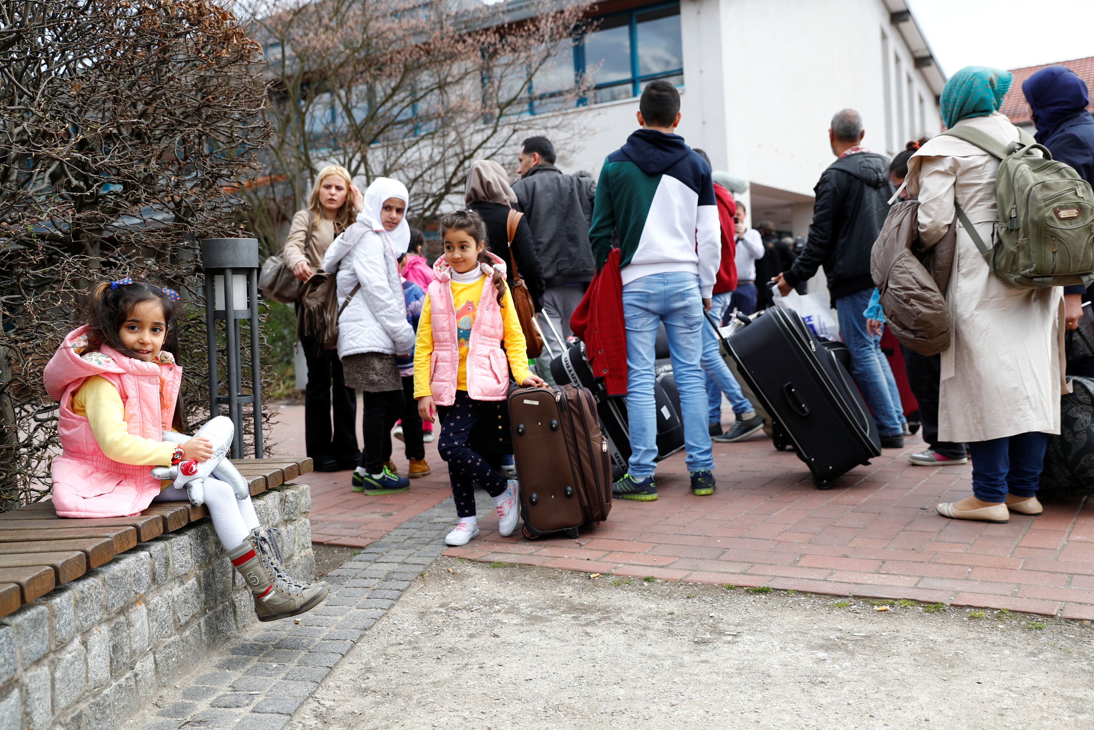 Syrian migrants allowed in by Merkel vote to choose her successor | Reuters