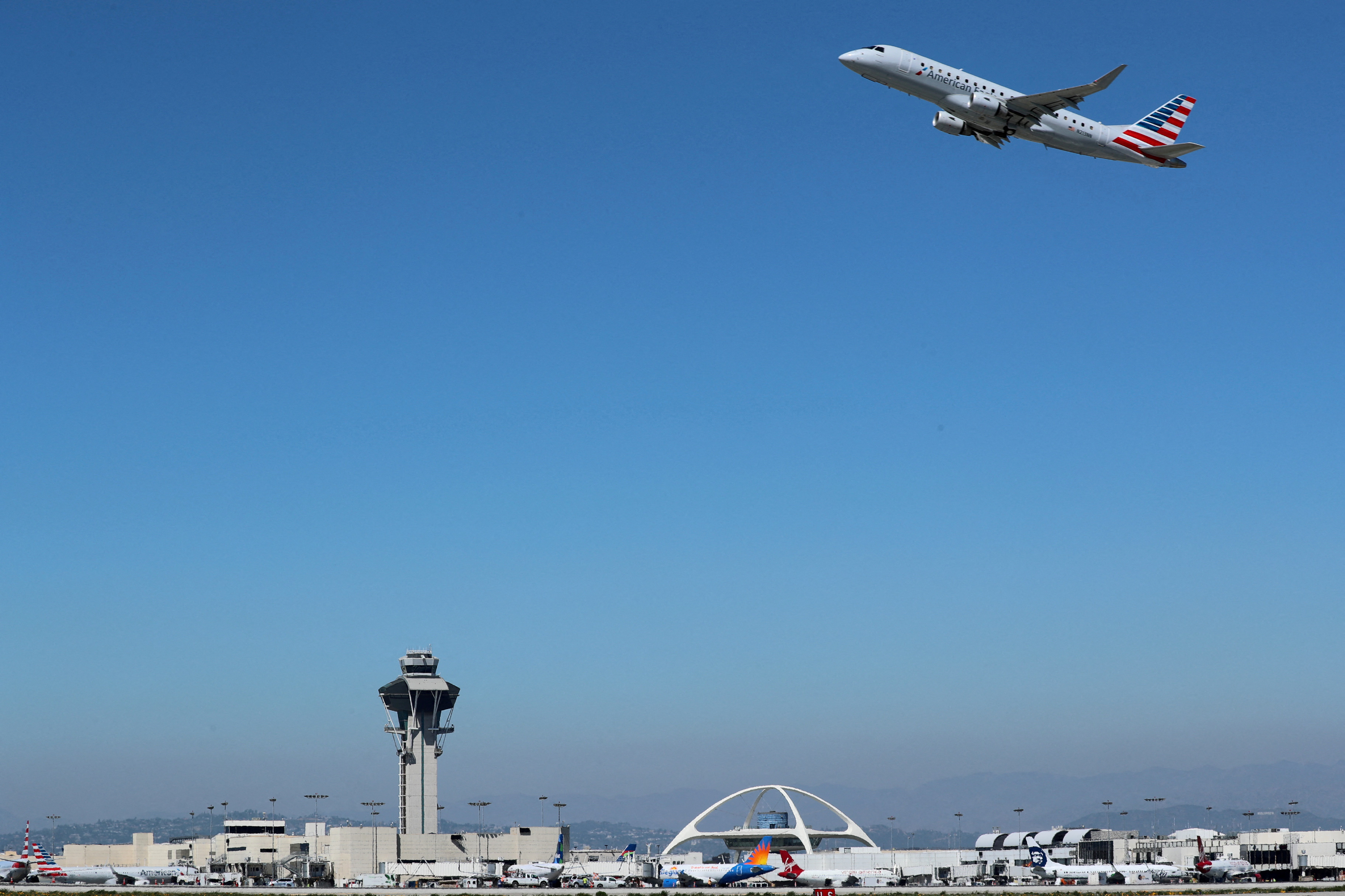 An American Airlines Embraer ERJ-175LR plane takes off from Los Angeles International airport