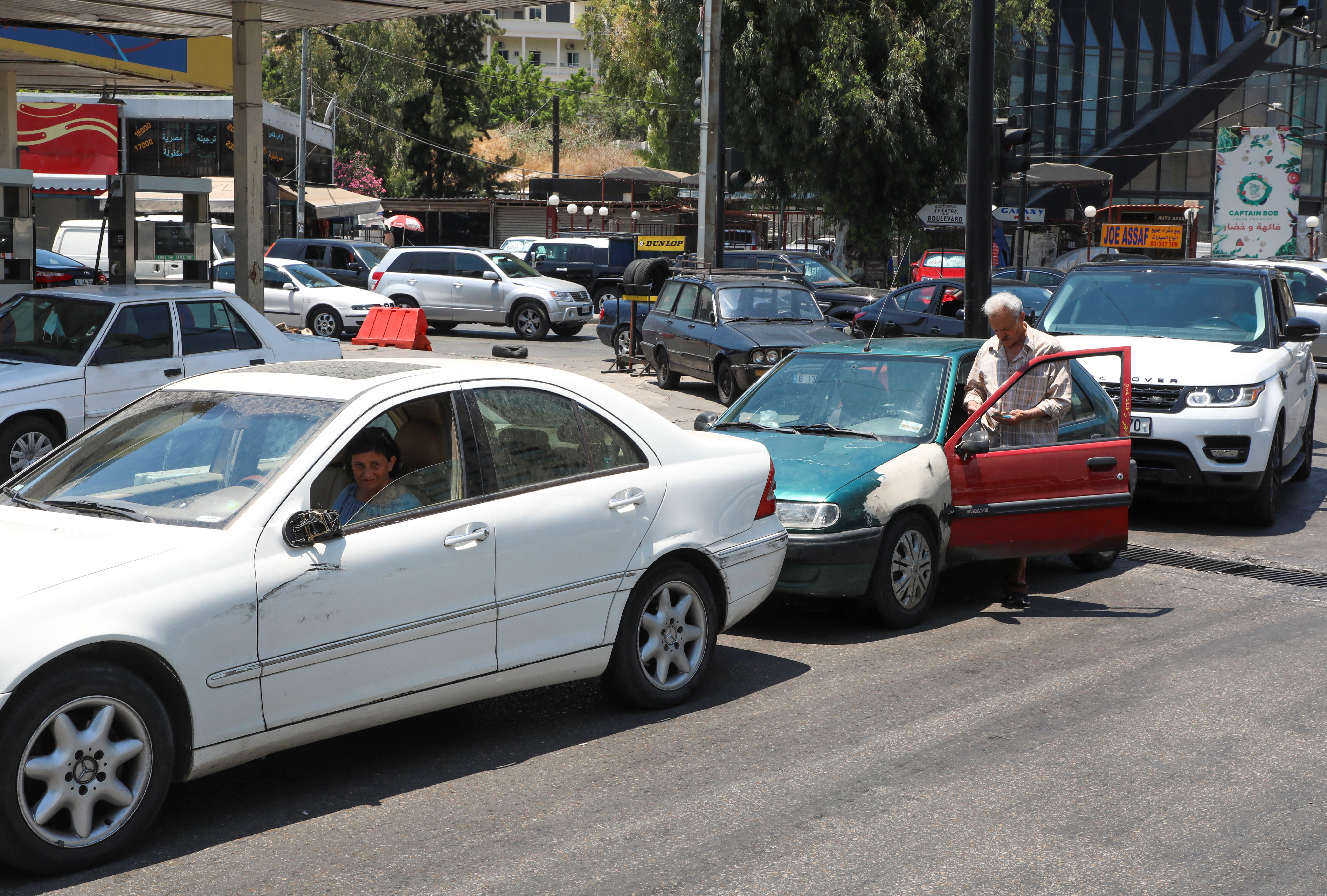Cars wait in line for fuel at a gas station in Beirut