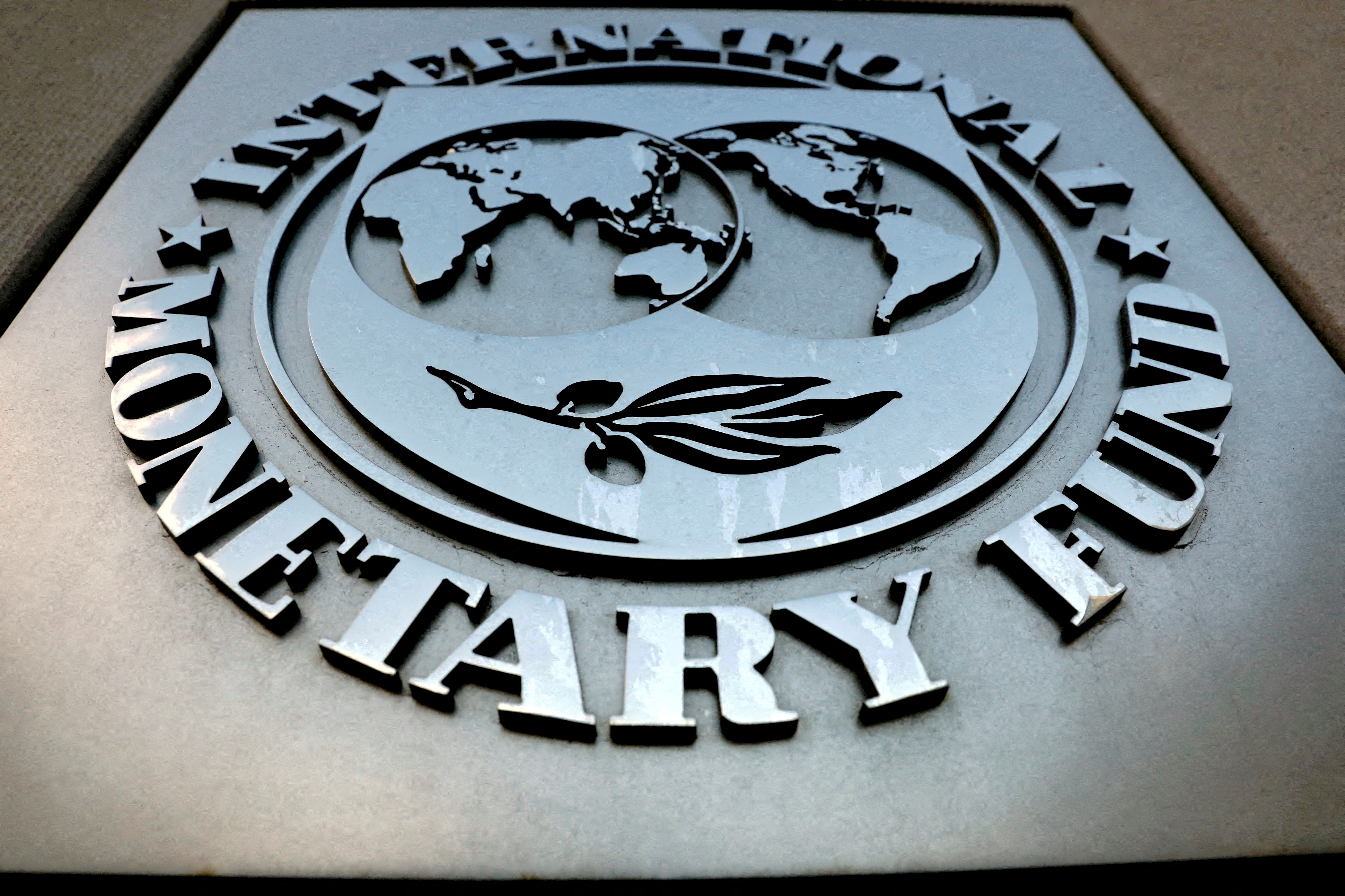 The IMF logo is seen outside the headquarters building in Washington