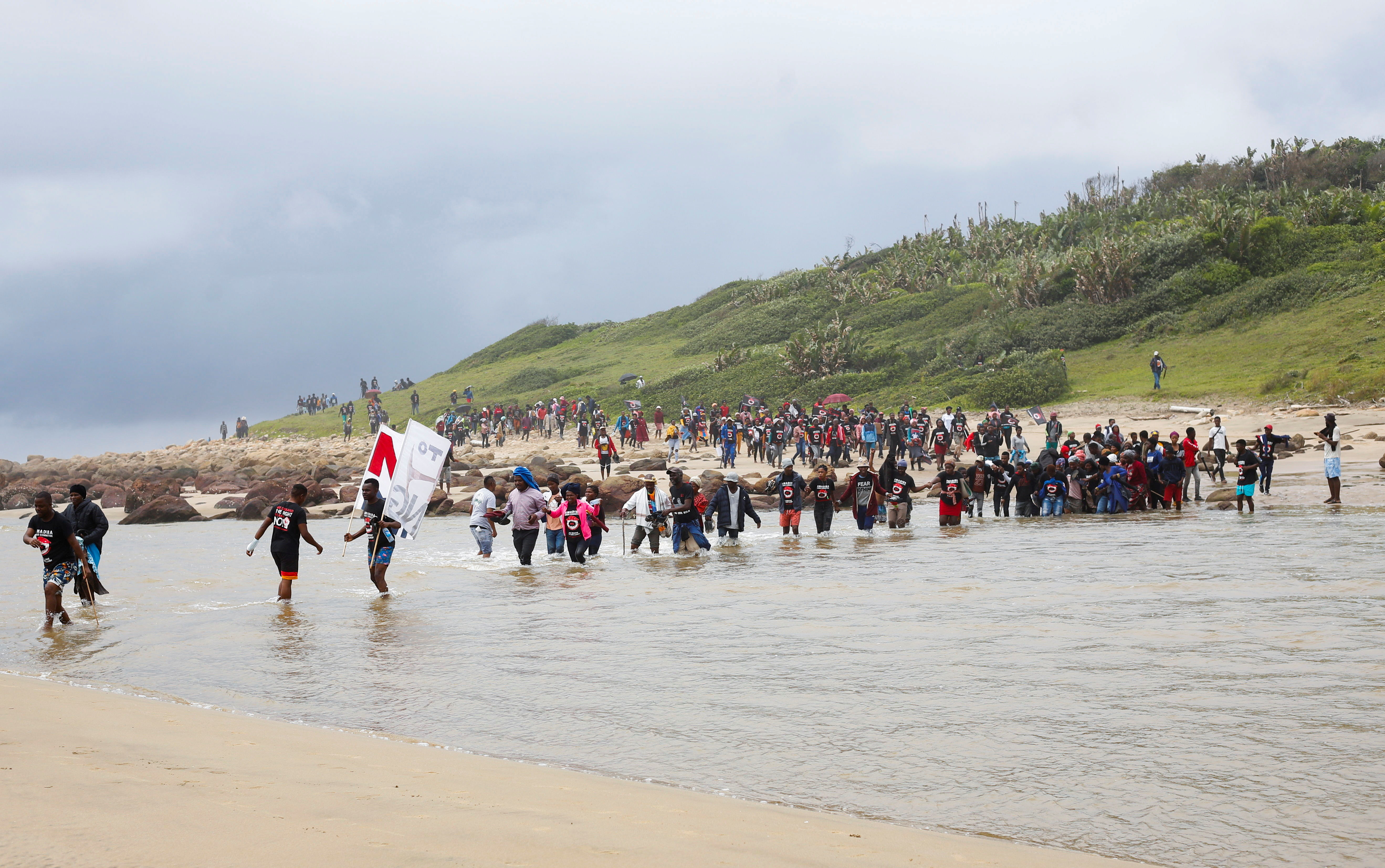 Wild Coast residents join a demonstration against Royal Dutch Shell's plans to start seismic surveys to explore petroleum systems off the country's popular Wild Coast at Mzamba Beach, Sigidi, South Africa, December 5, 2021. REUTERS/Rogan Ward