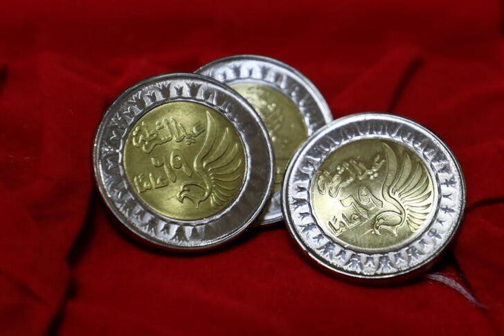 Coins of a one Egyptian pound are seen at the Mint Museum to mark police day which falls on January 25, the anniversary of the country's 2011 uprising, in Cairo
