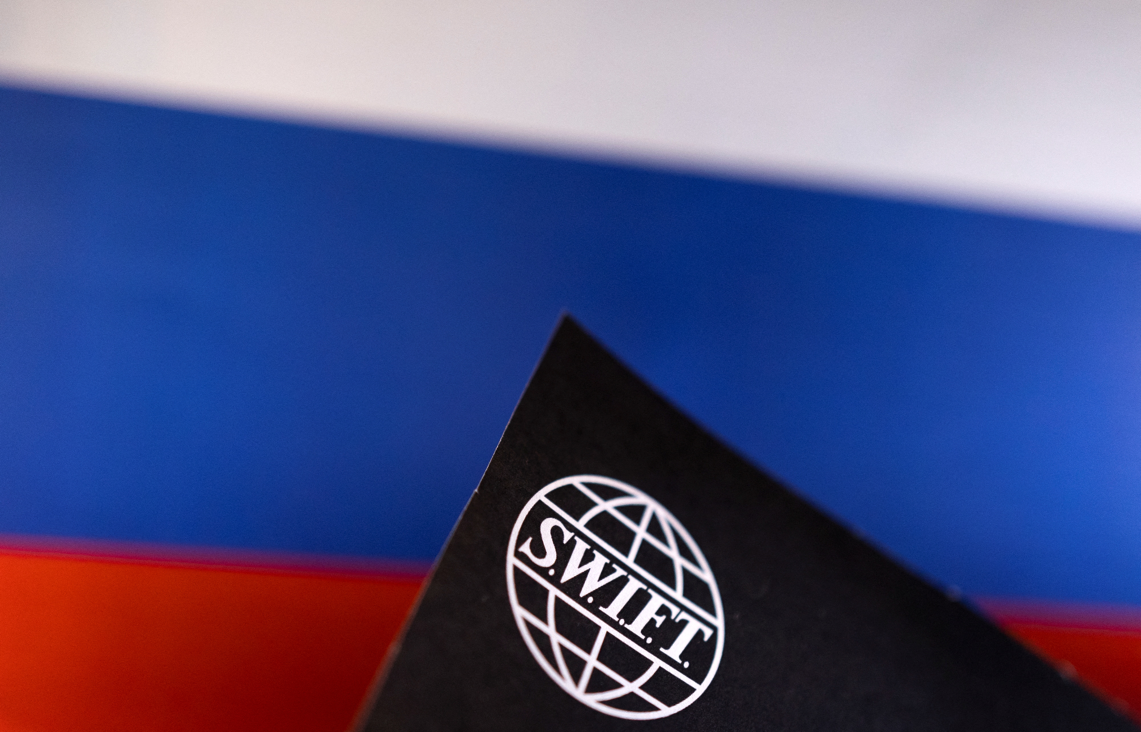 Illustration shows Swift logo and Russian flag