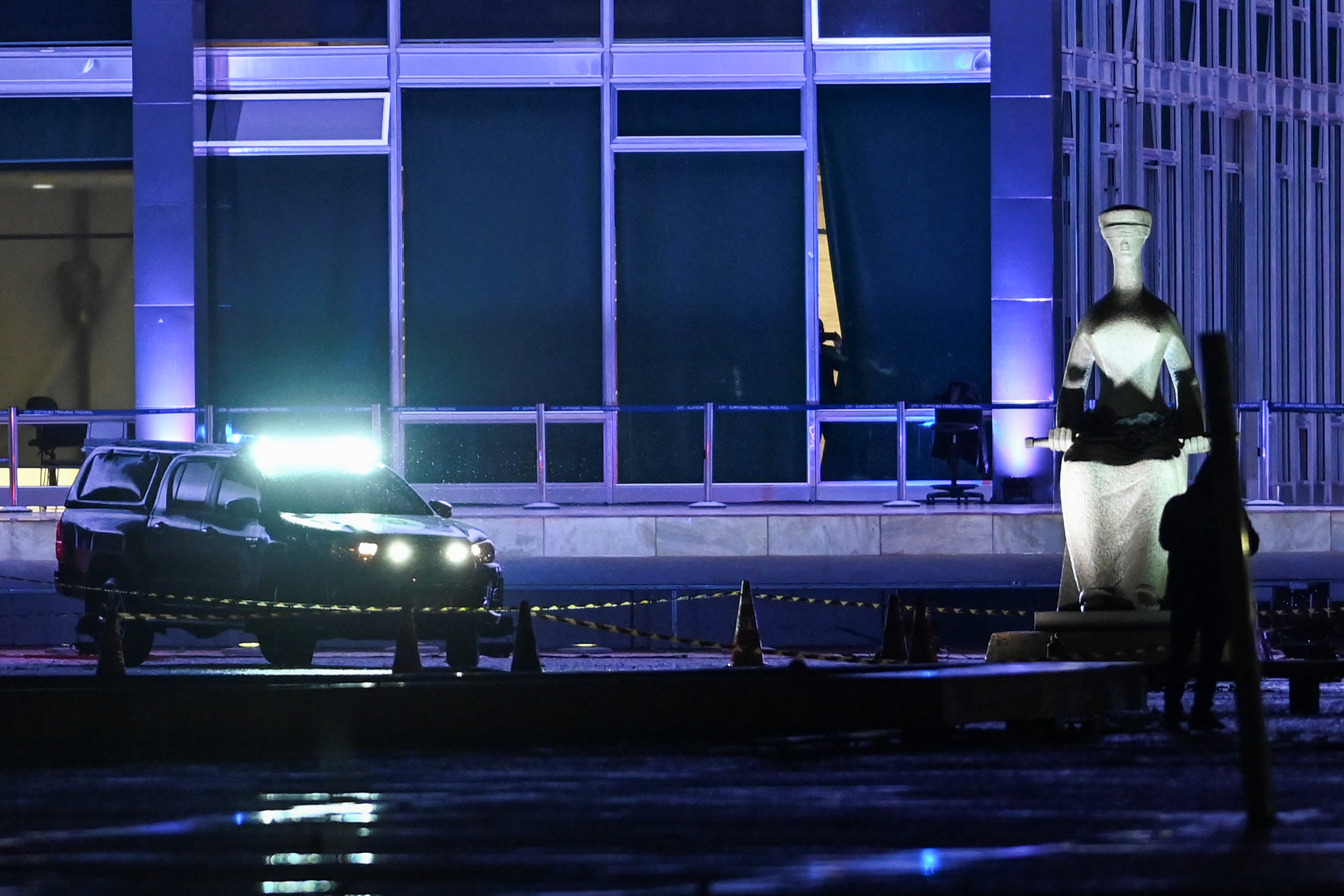 A police vehicle is seen outside the Brazilian Supreme Court after explosions in the Three Powers Square in Brasilia